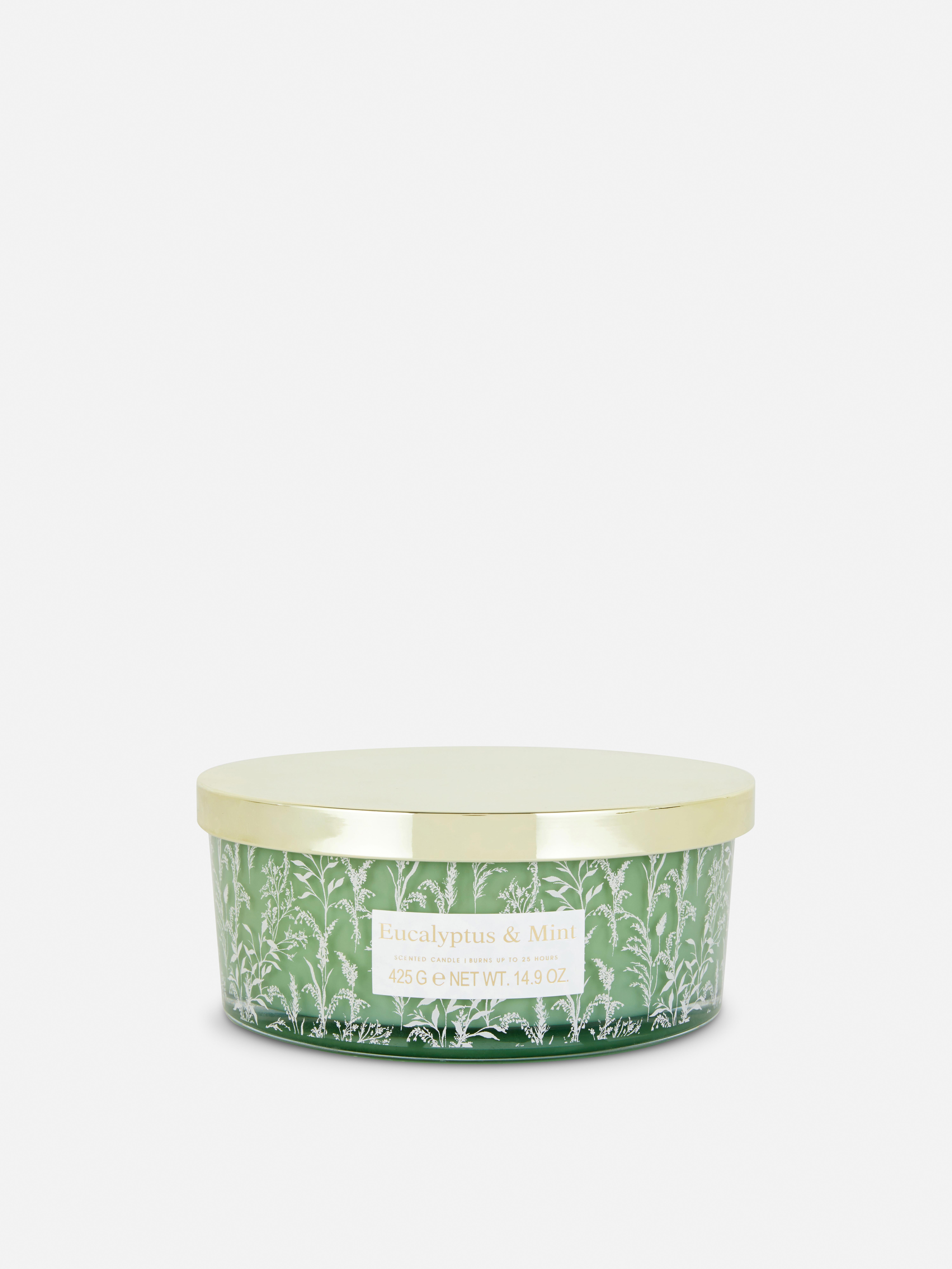 Bougie parfumée à trois mèches dans un pot automnal Vert
