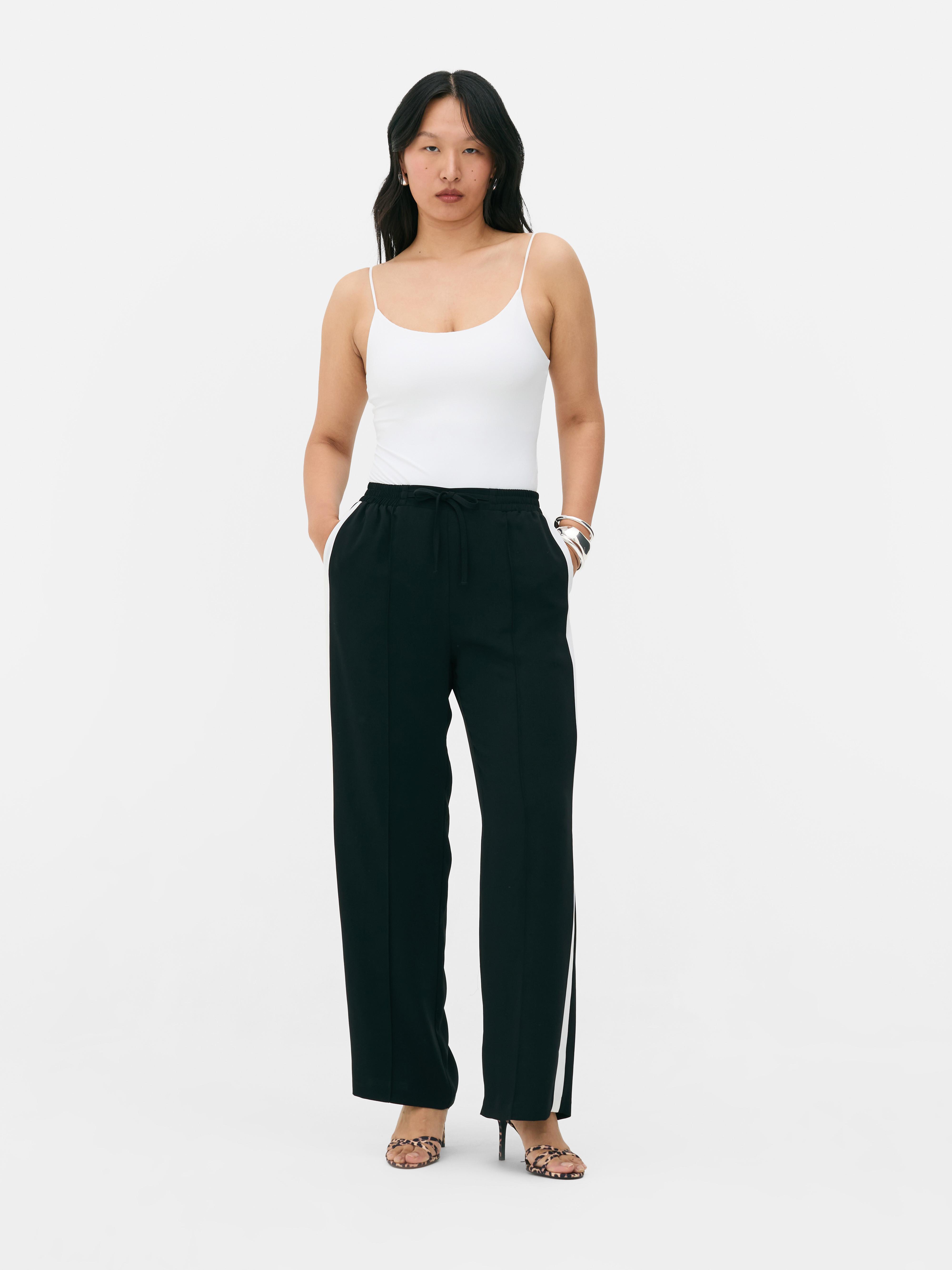 Black joggers with white side stripe on sale