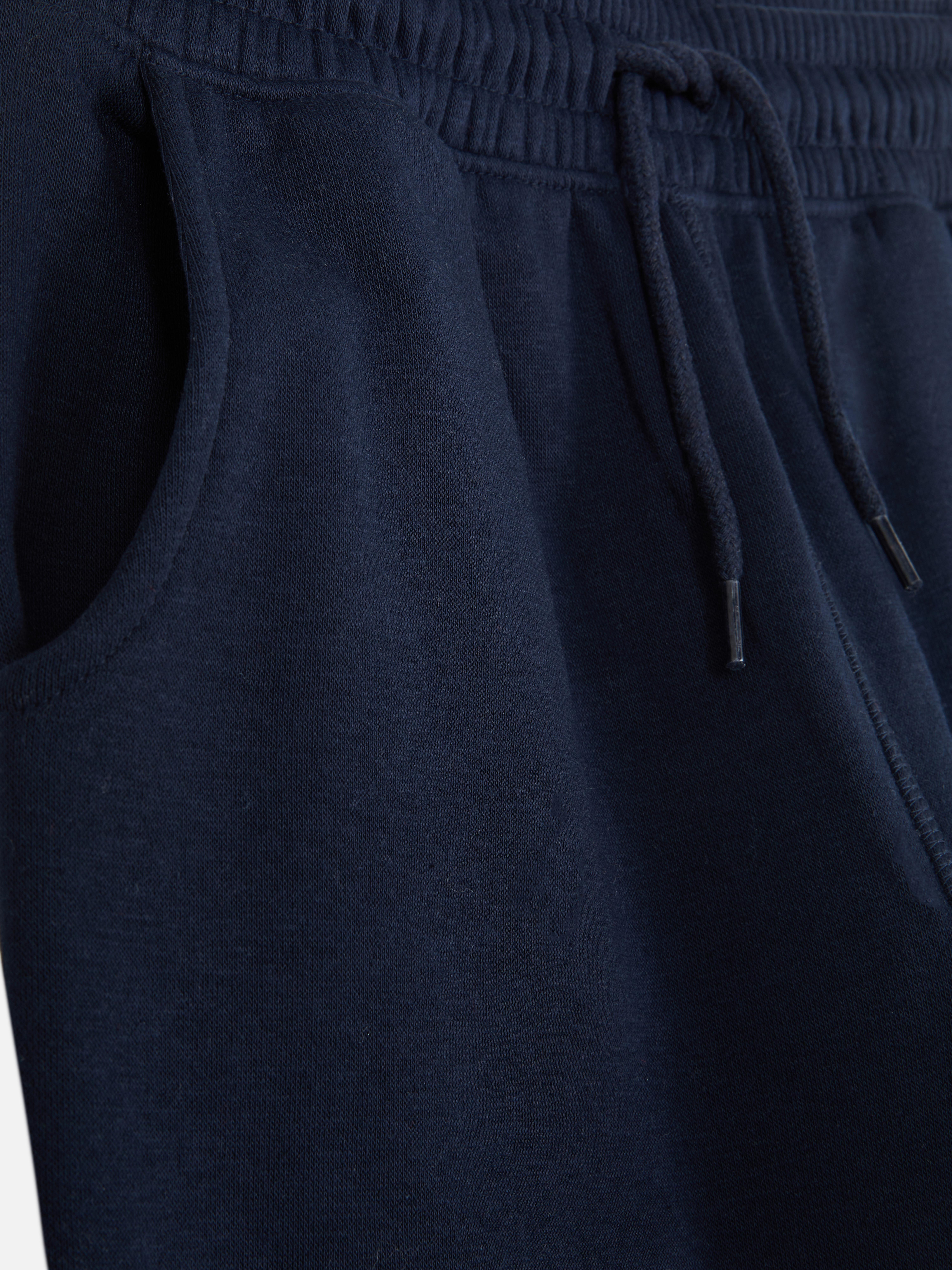 Pantalones de chándal con cordón y bajos ajustados