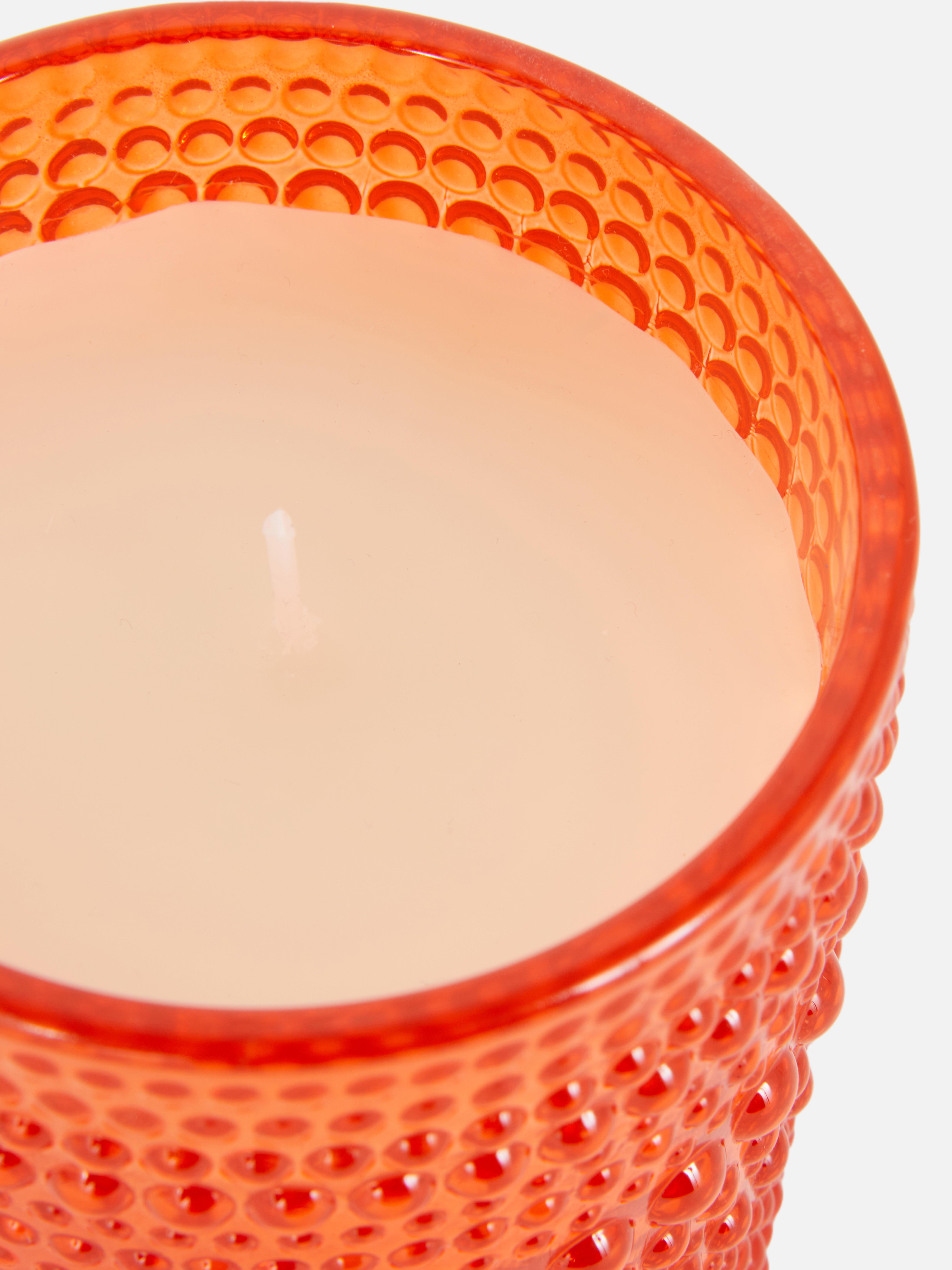 Vela en tarro de vidrio con burbujas