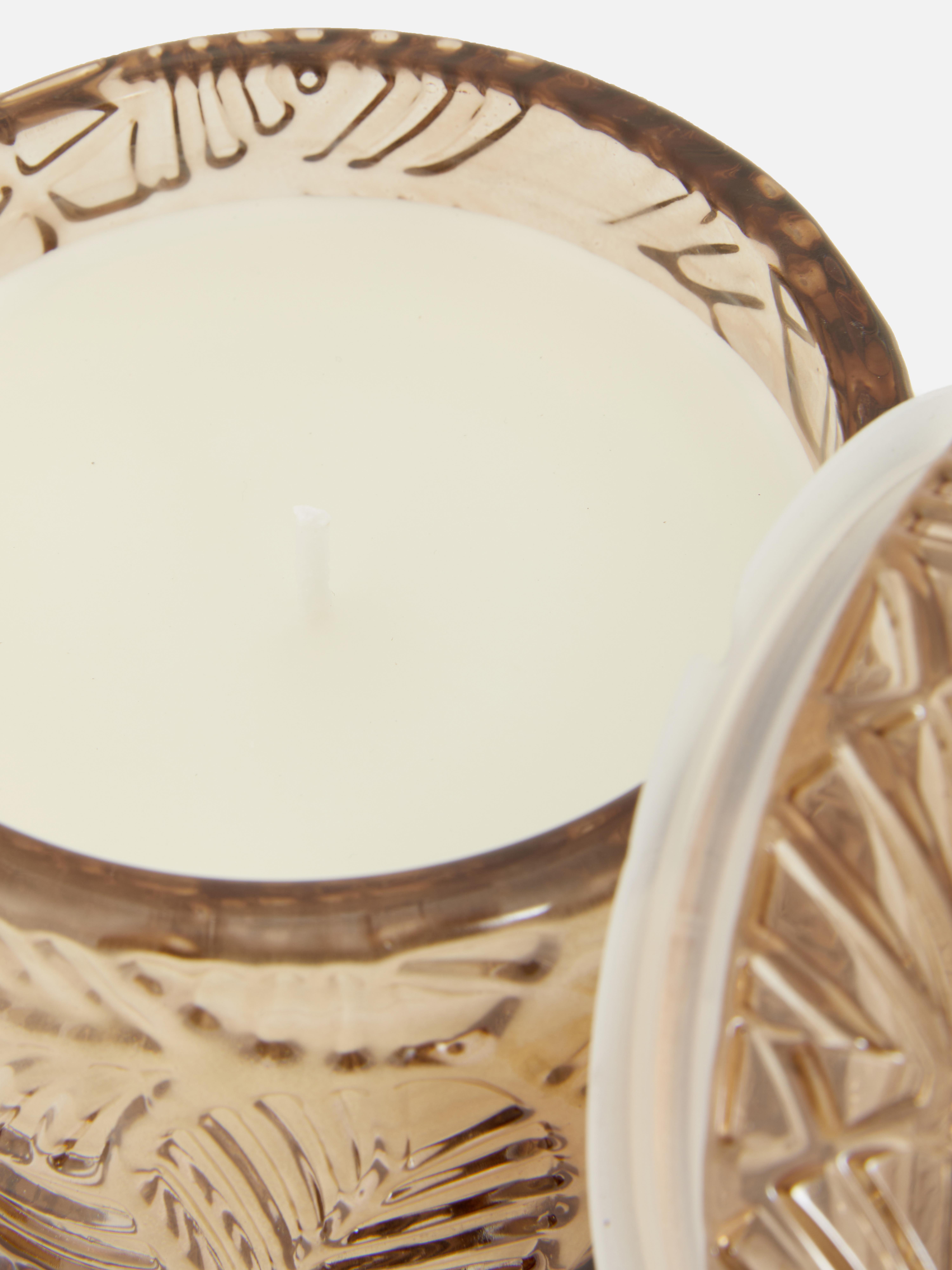 Candle in textured glass jar
