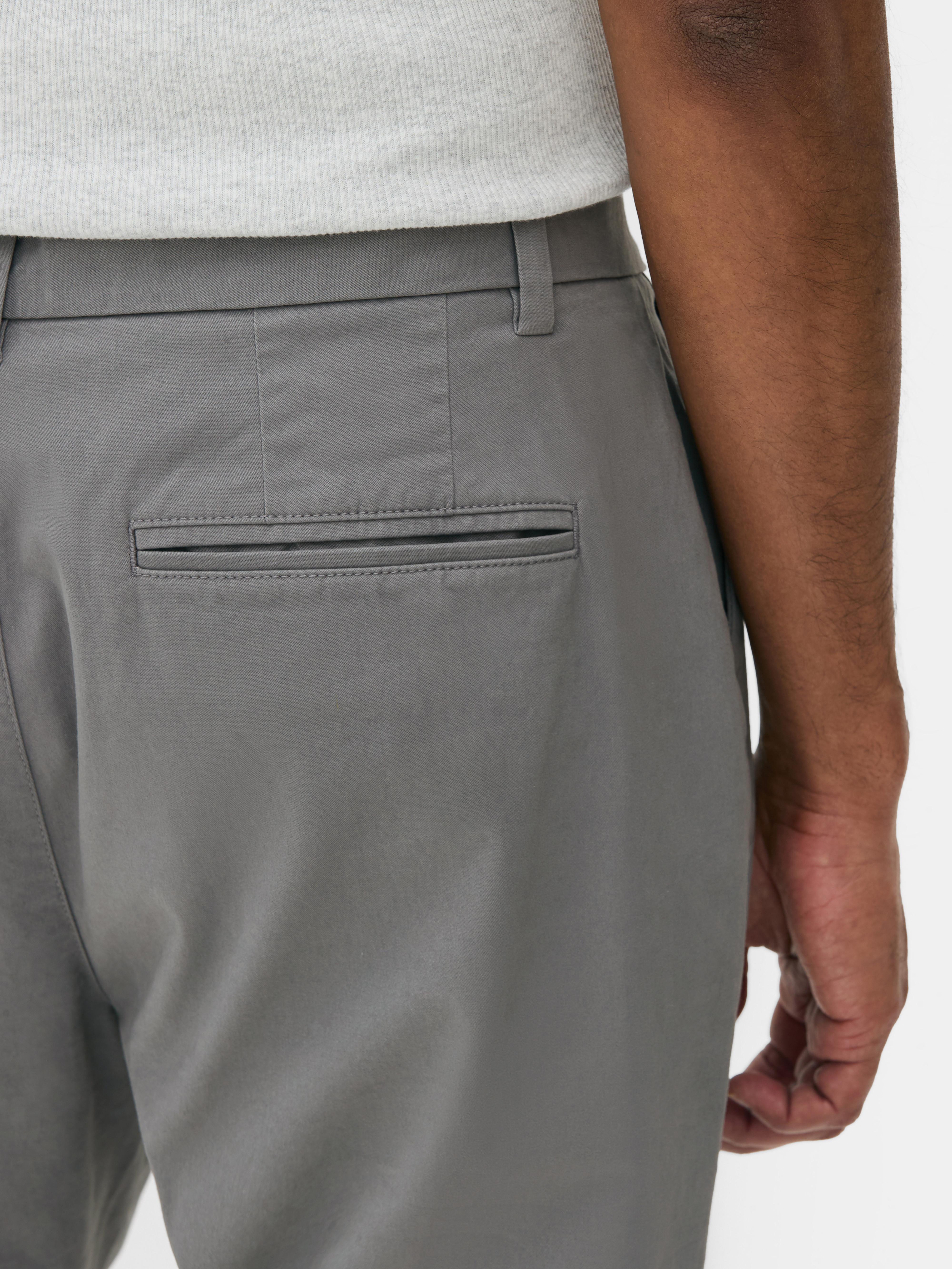 Calças chino elásticas corte justo
