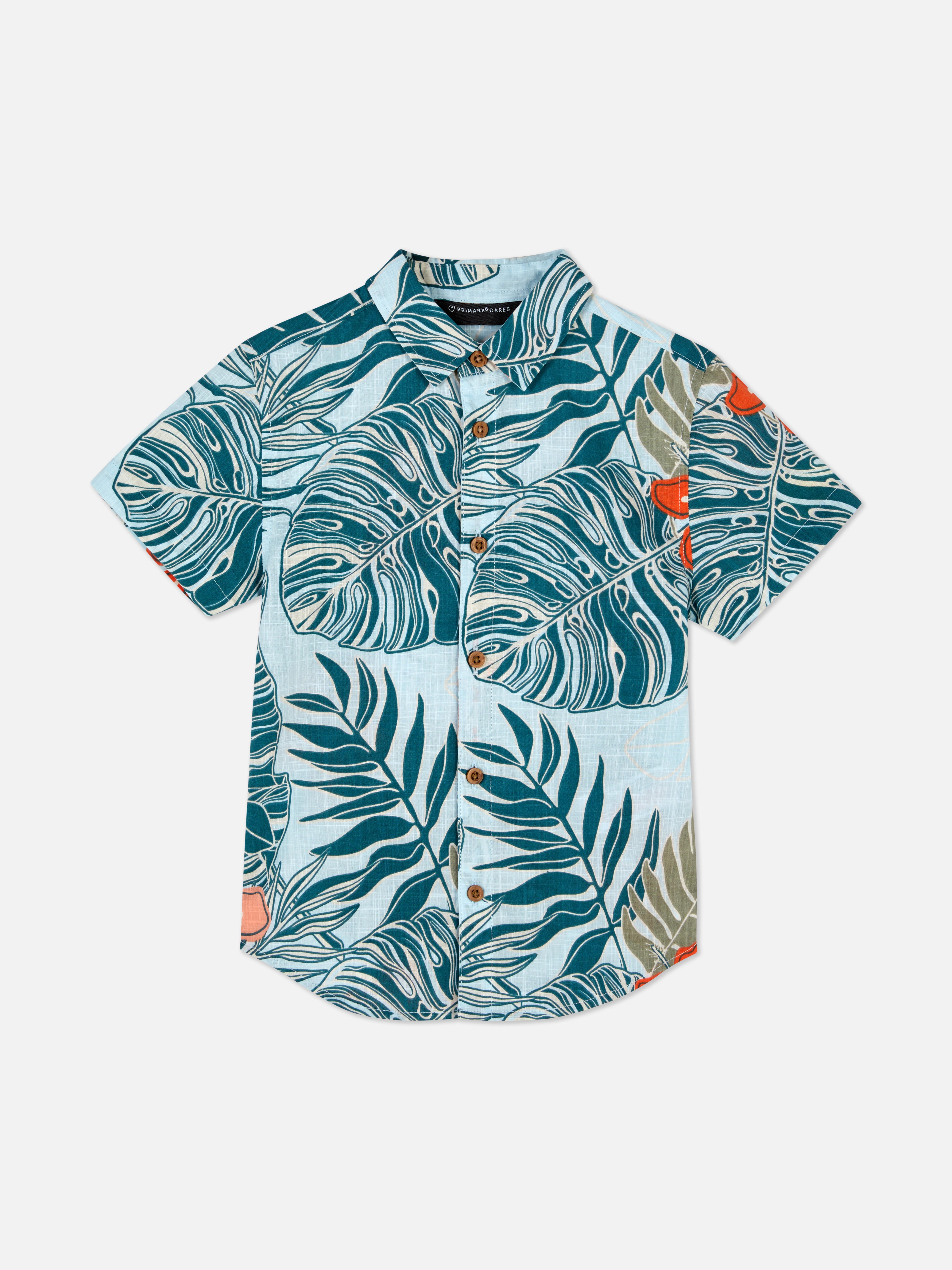 Camisa con hojas tropicales