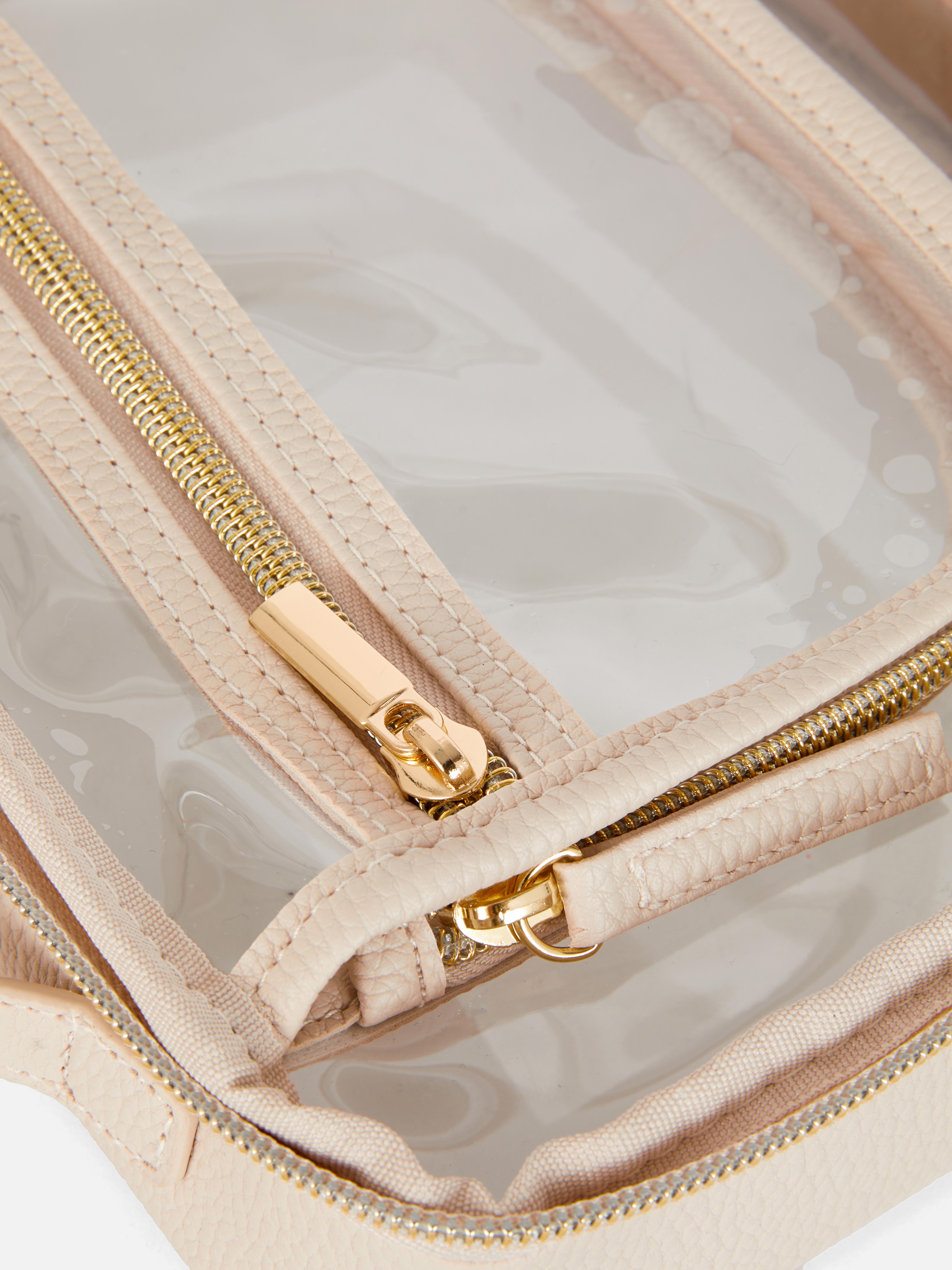 Trousse de toilette transparente à bordures dorées