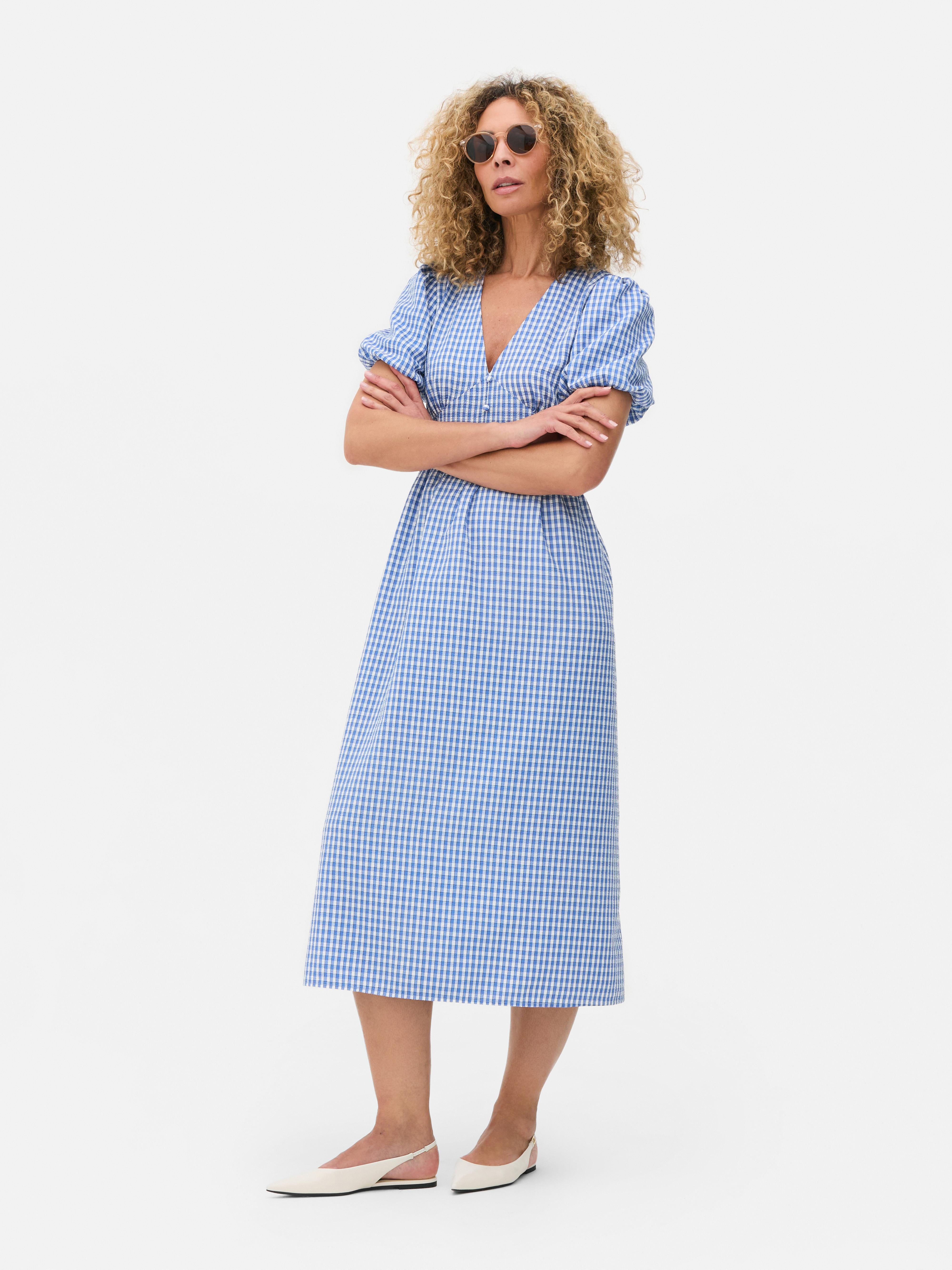 Robe mi-longue texturée à boutons et motif