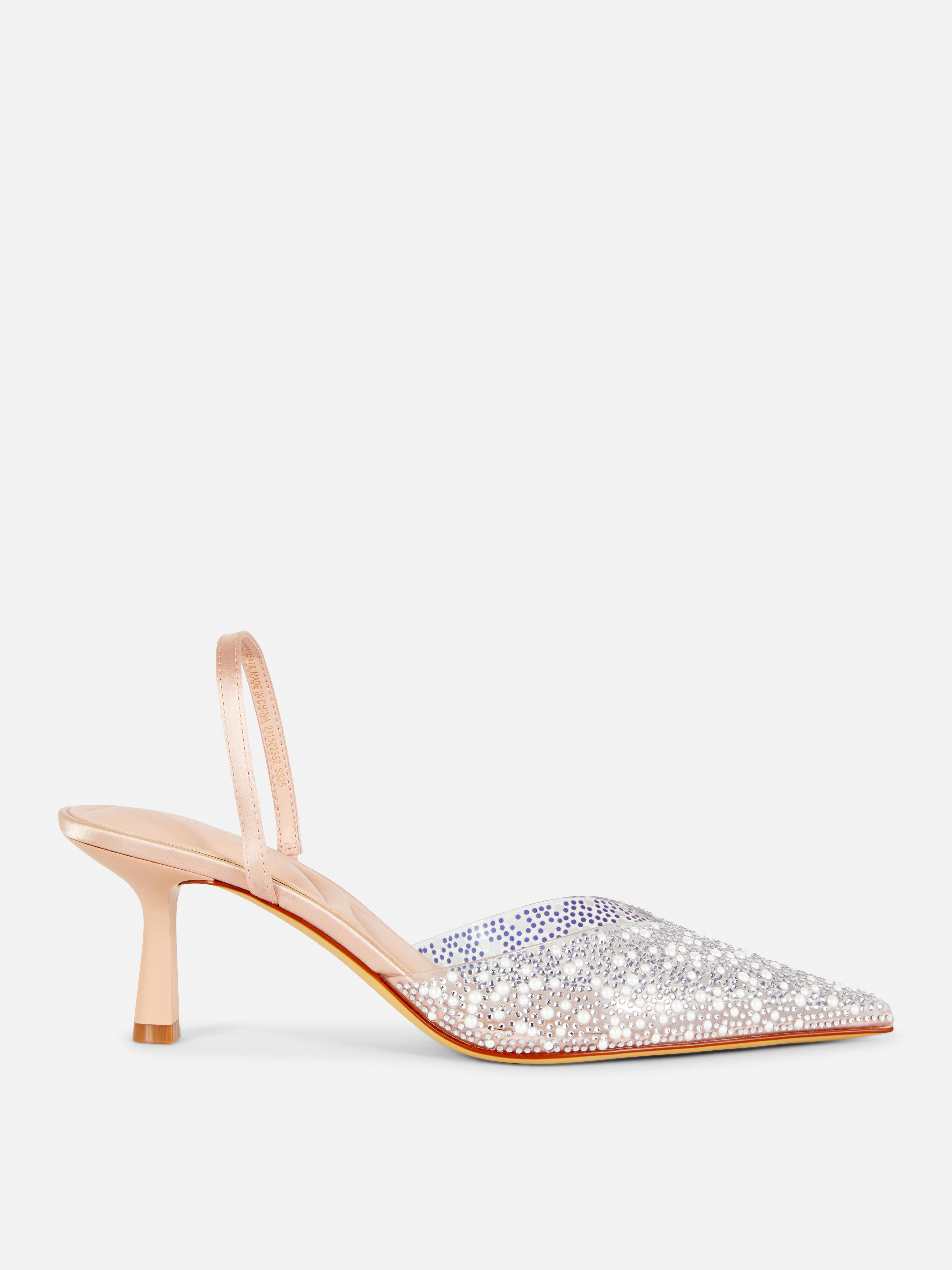 Transparante slingback-pumps met versiering