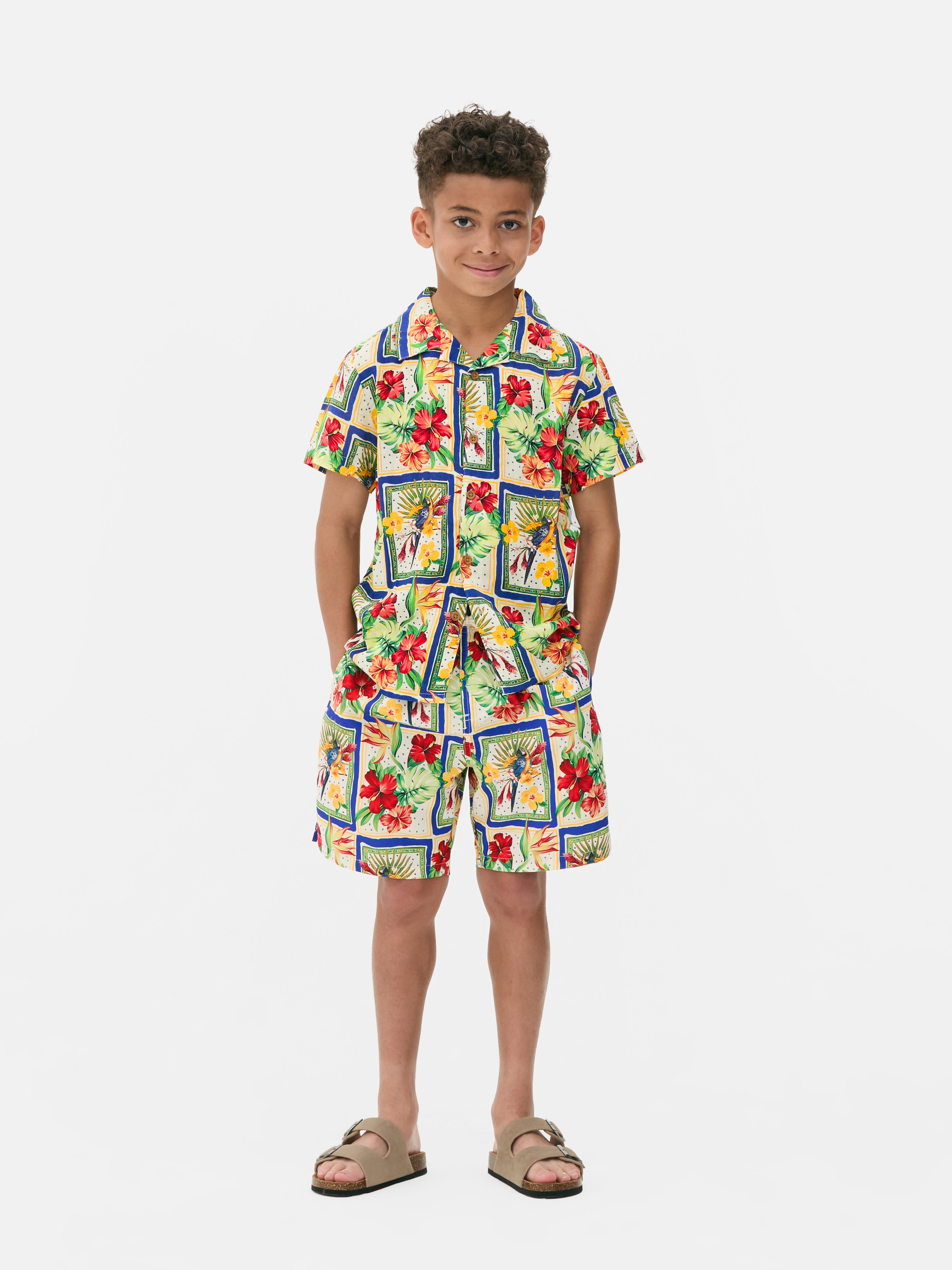 Camicia ragazzo con bottoni e fiori tropicali