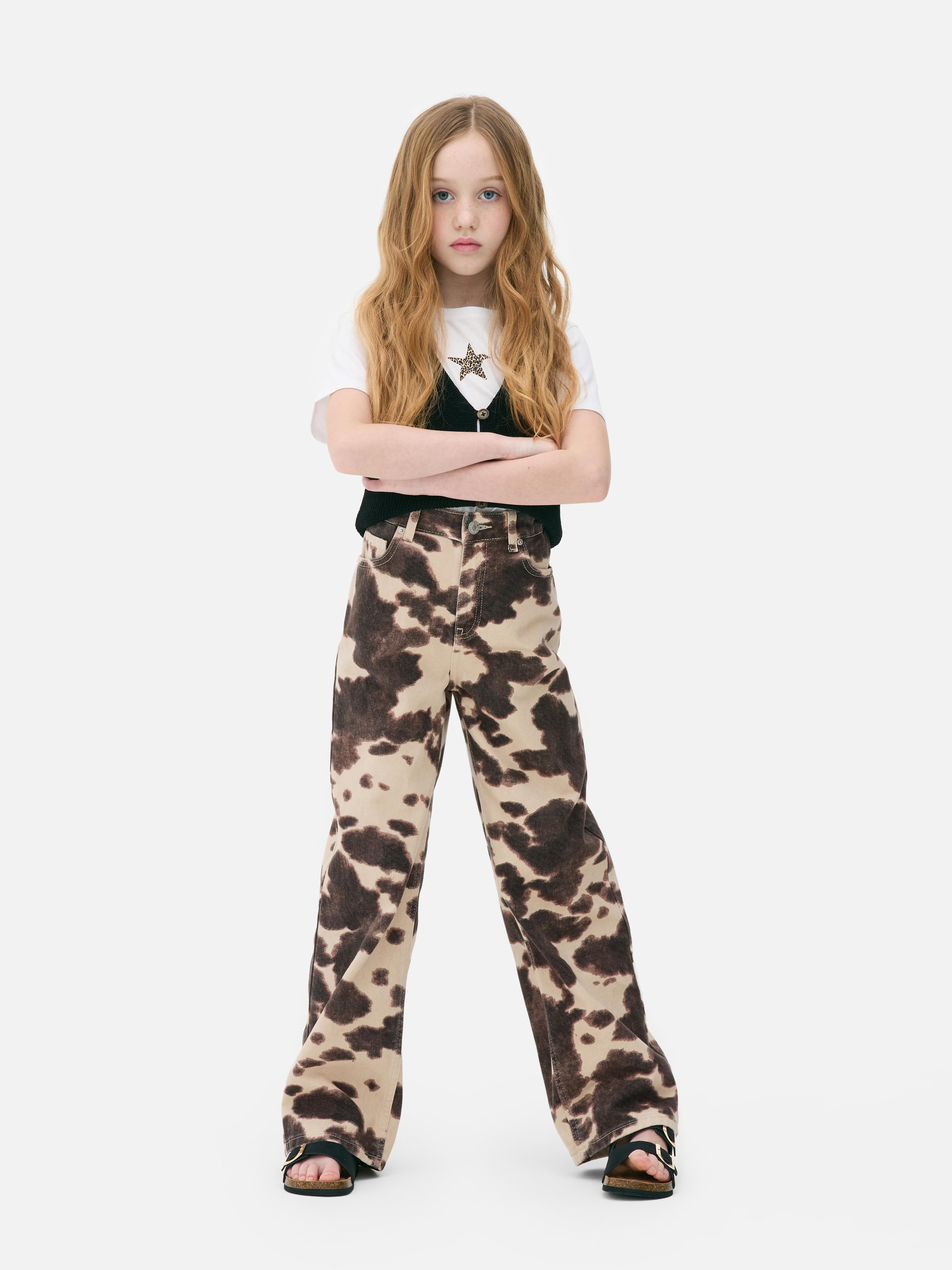 Jeans denim a gamba larga con stampa mucca