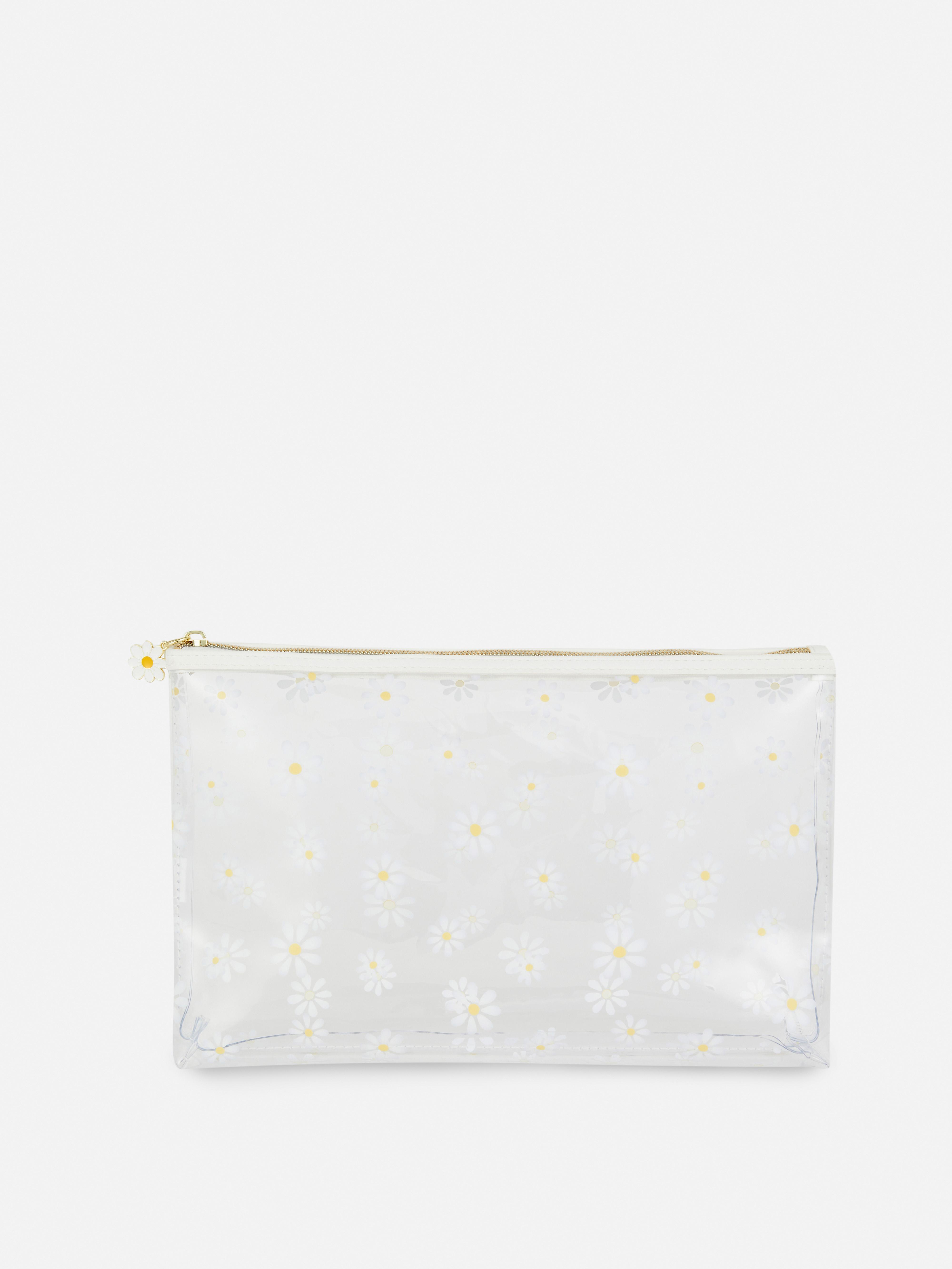 Trousse de toilette transparente à marguerites