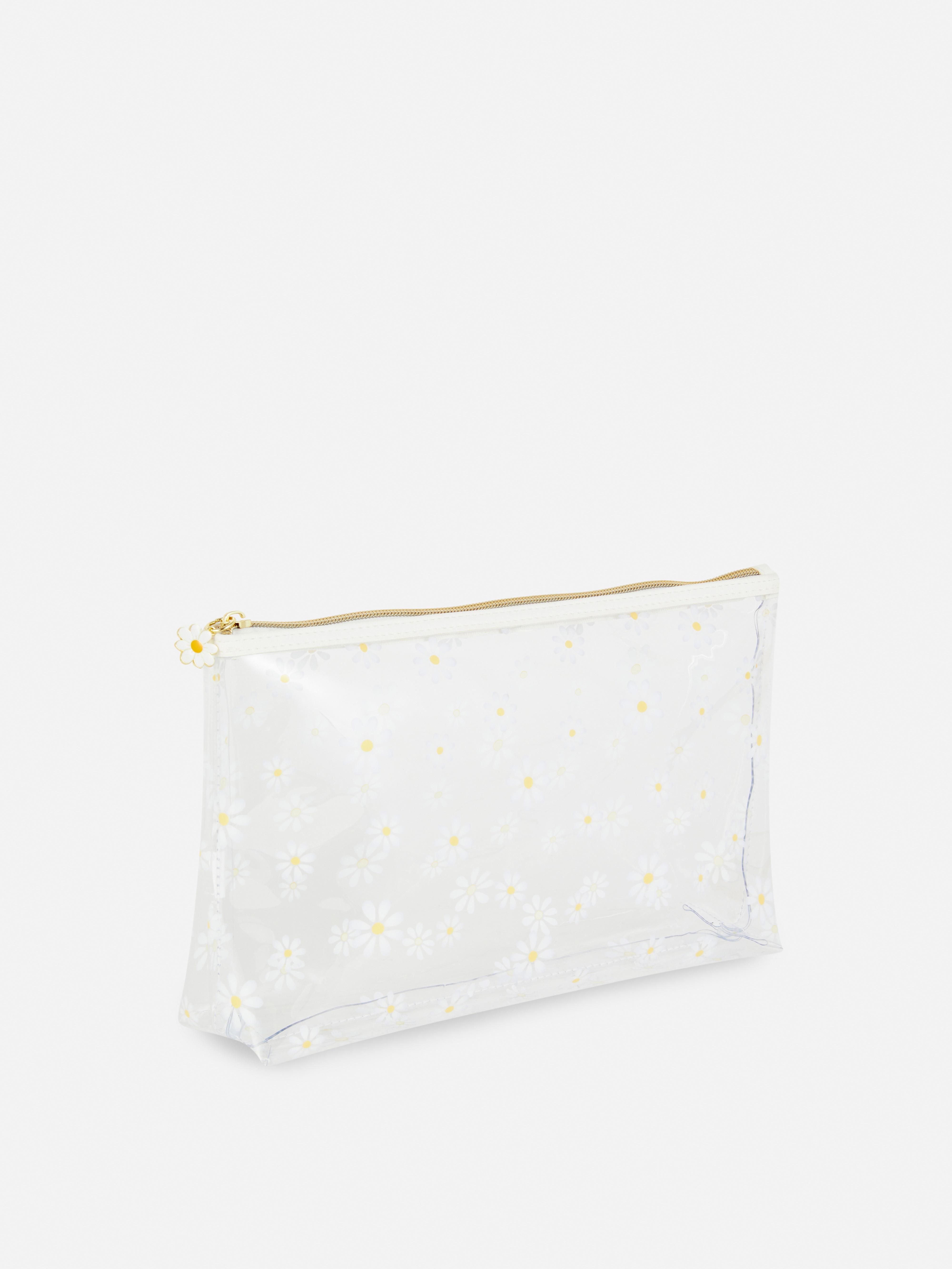 Trousse de toilette transparente à marguerites