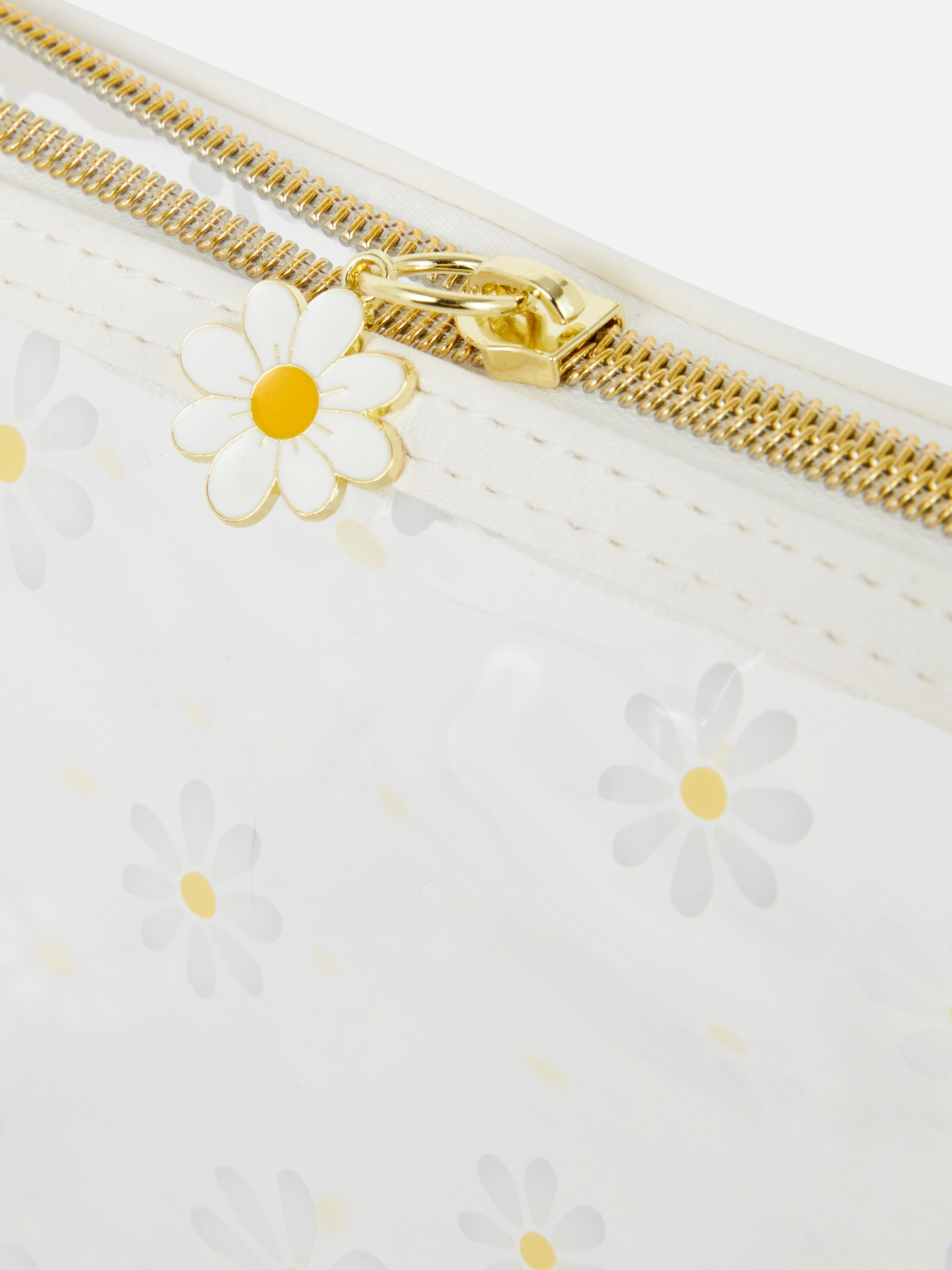 Trousse de toilette transparente à marguerites