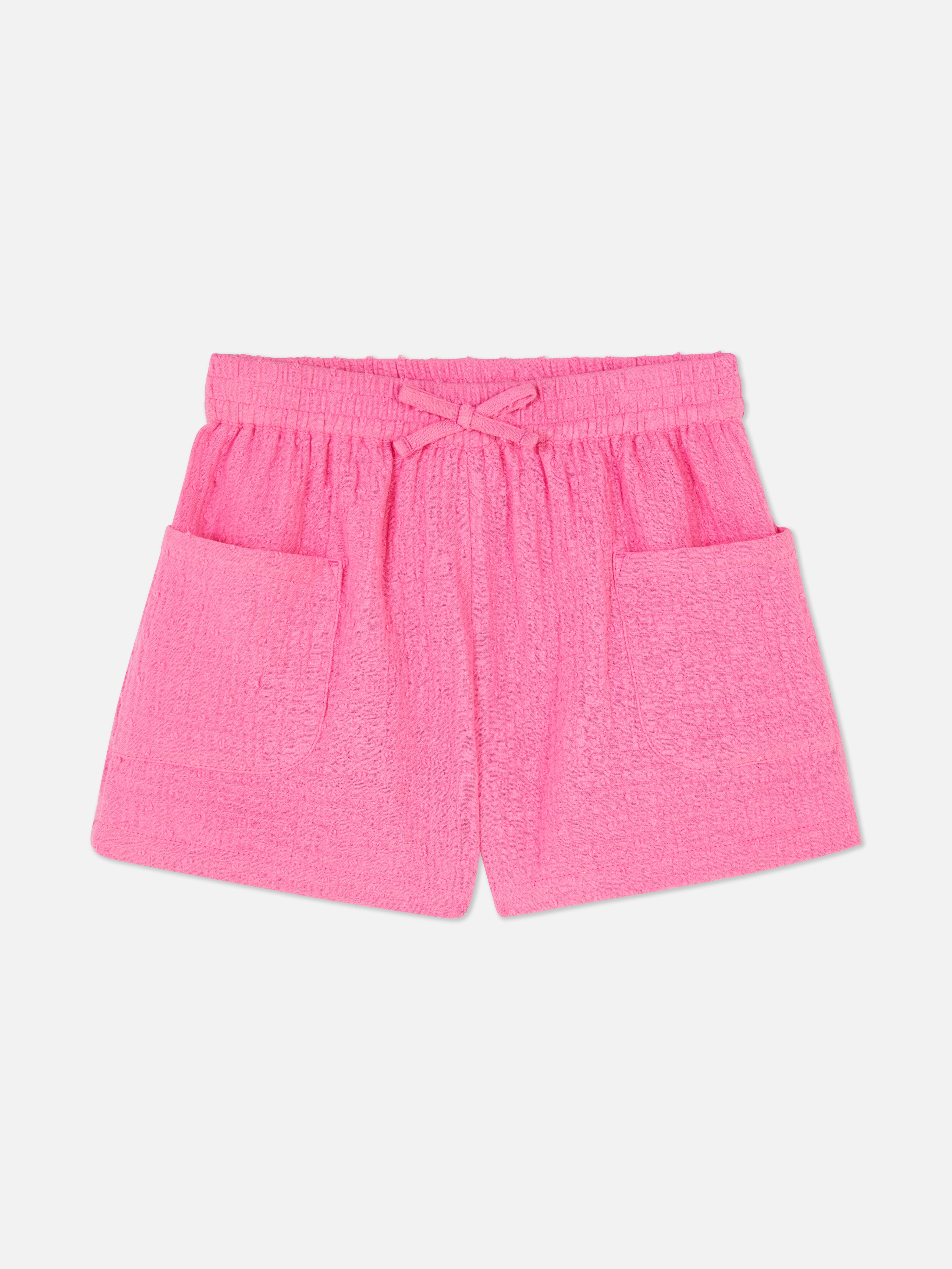 Pantalón corto en tejido dobby con topos