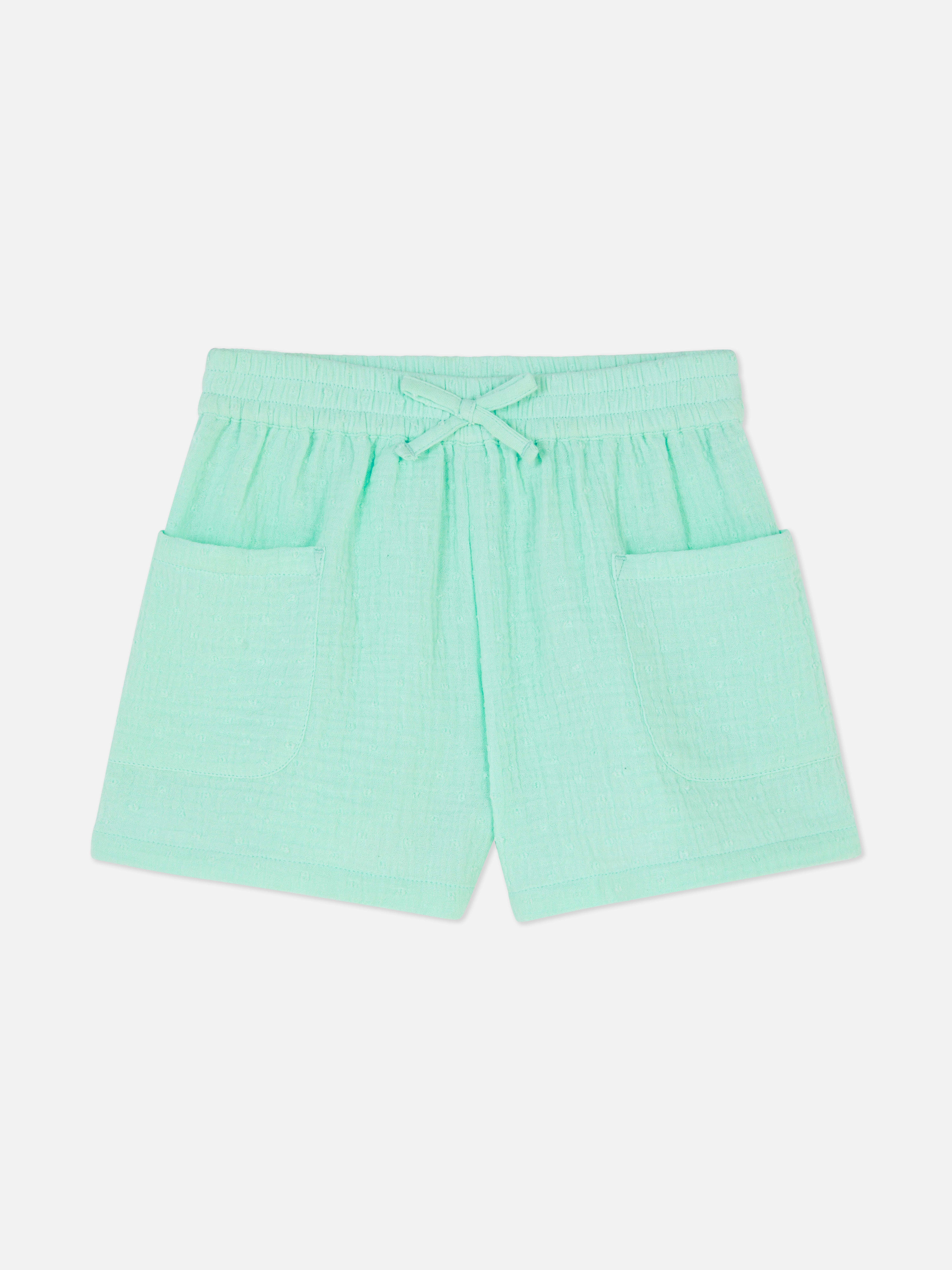 Pantalón corto en tejido dobby con topos