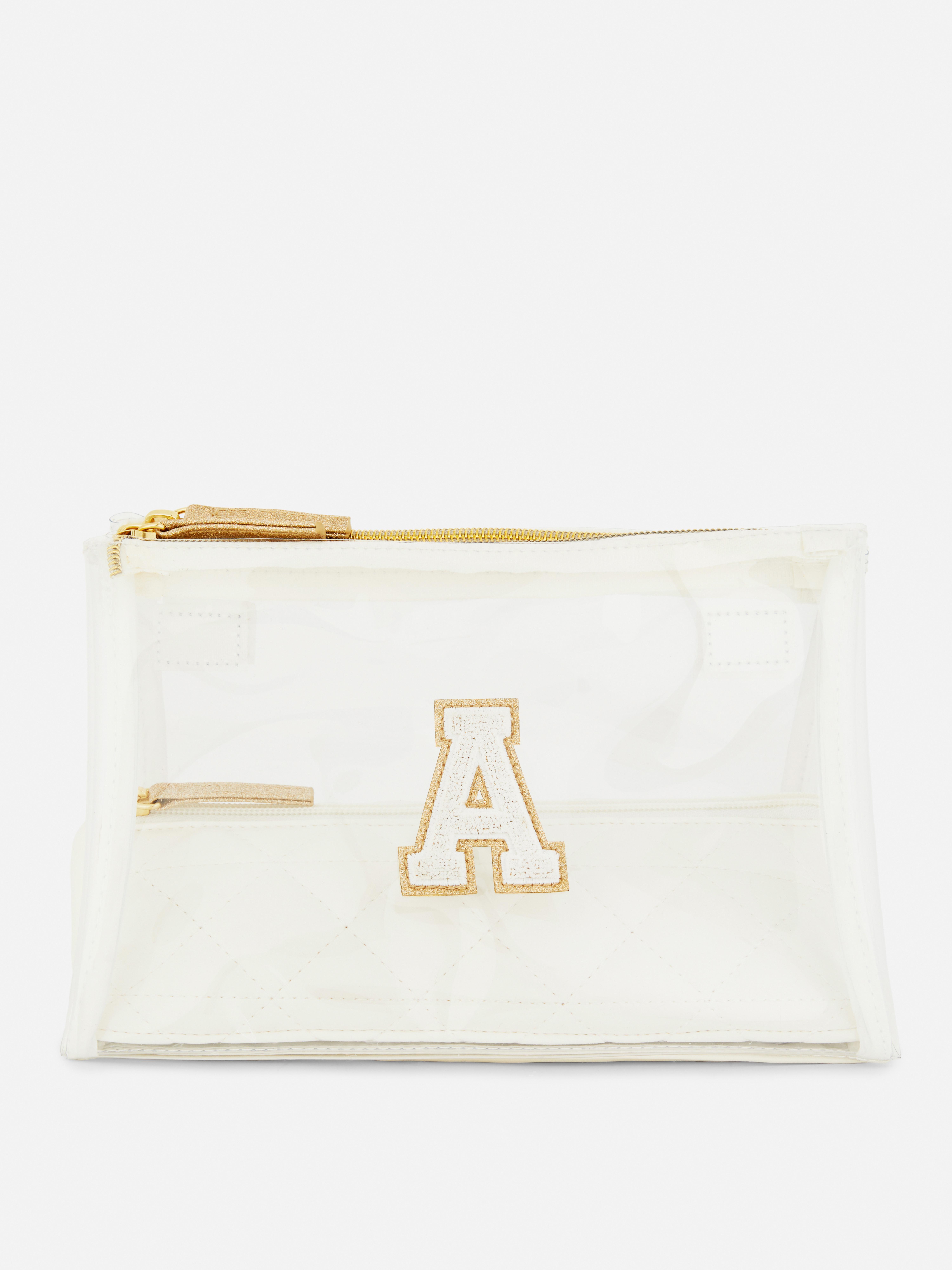 Trousse de toilette transparente à rabat et initiale