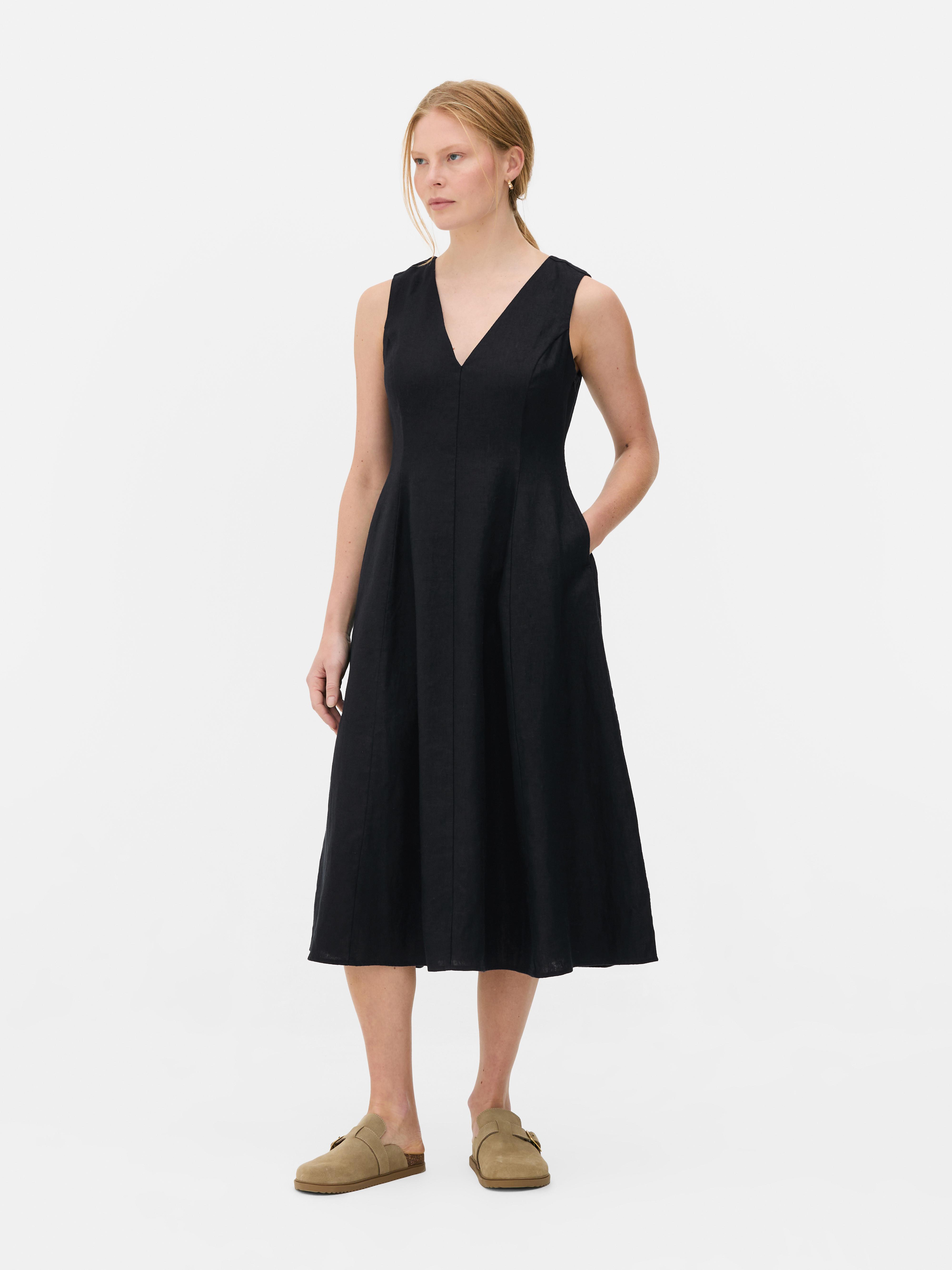 Mouwloze linnen jurk met V-hals The Edit