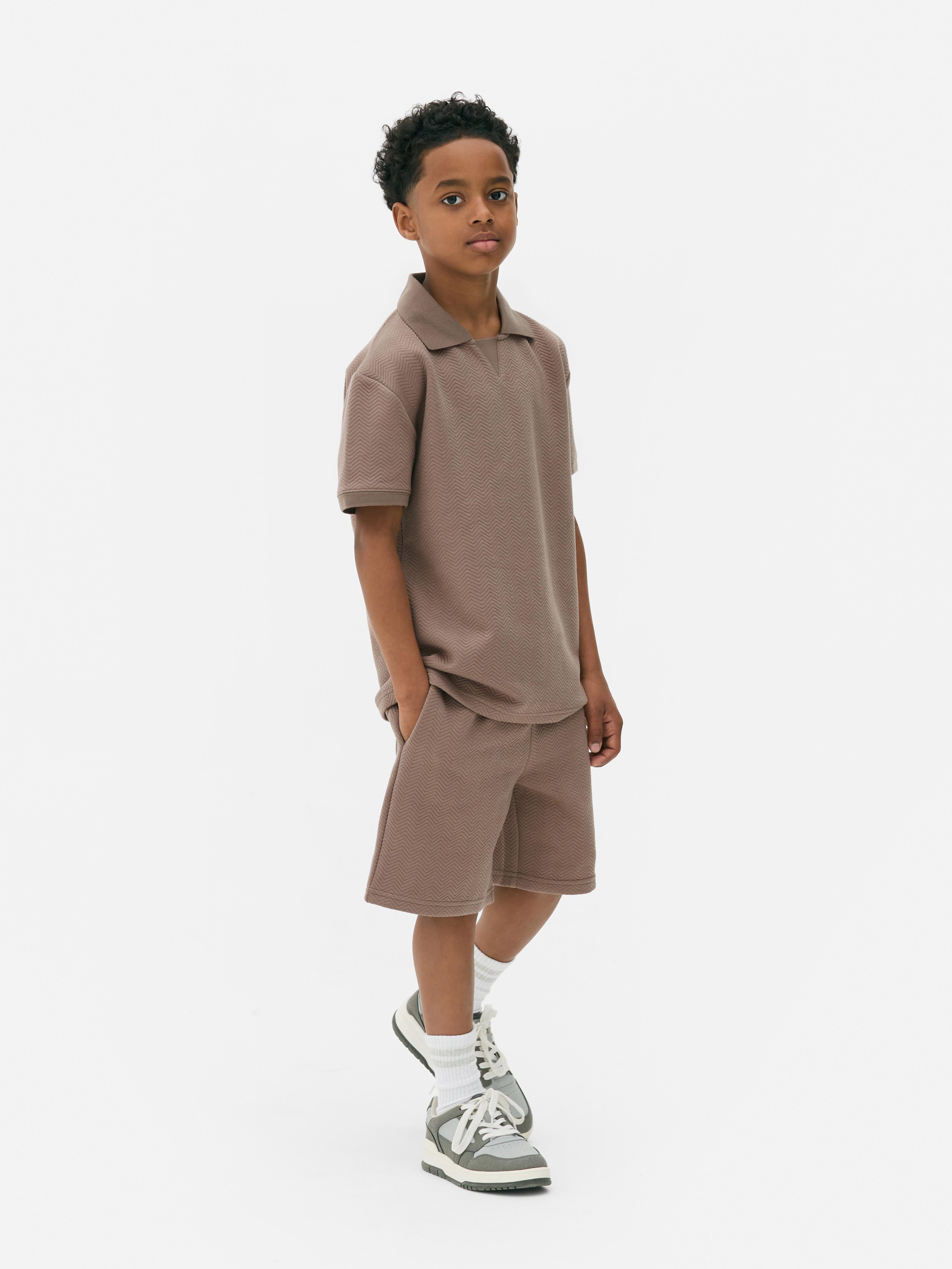 Conjunto polo/calções criança mais velha