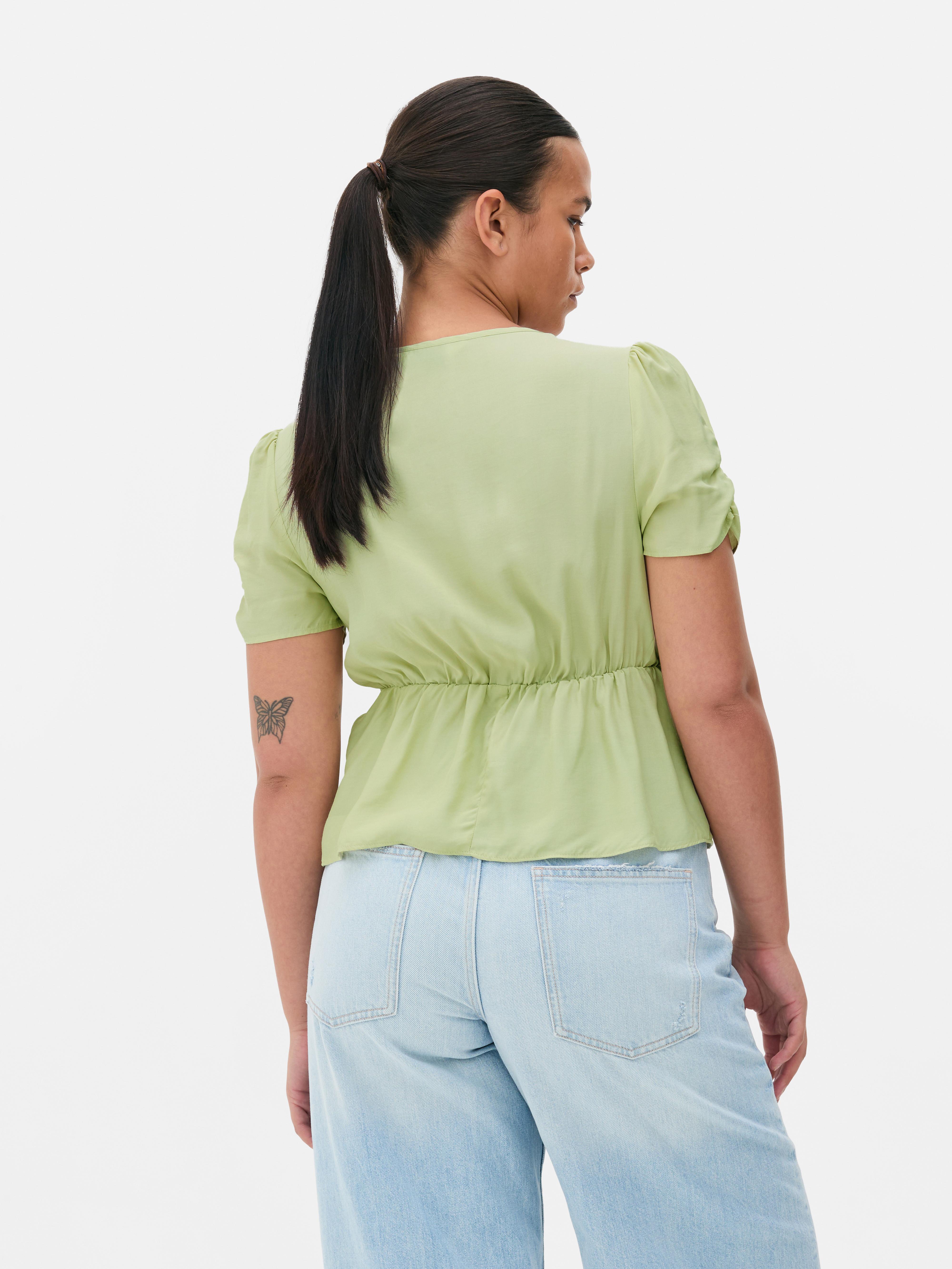 Camicetta drappeggiata con volant