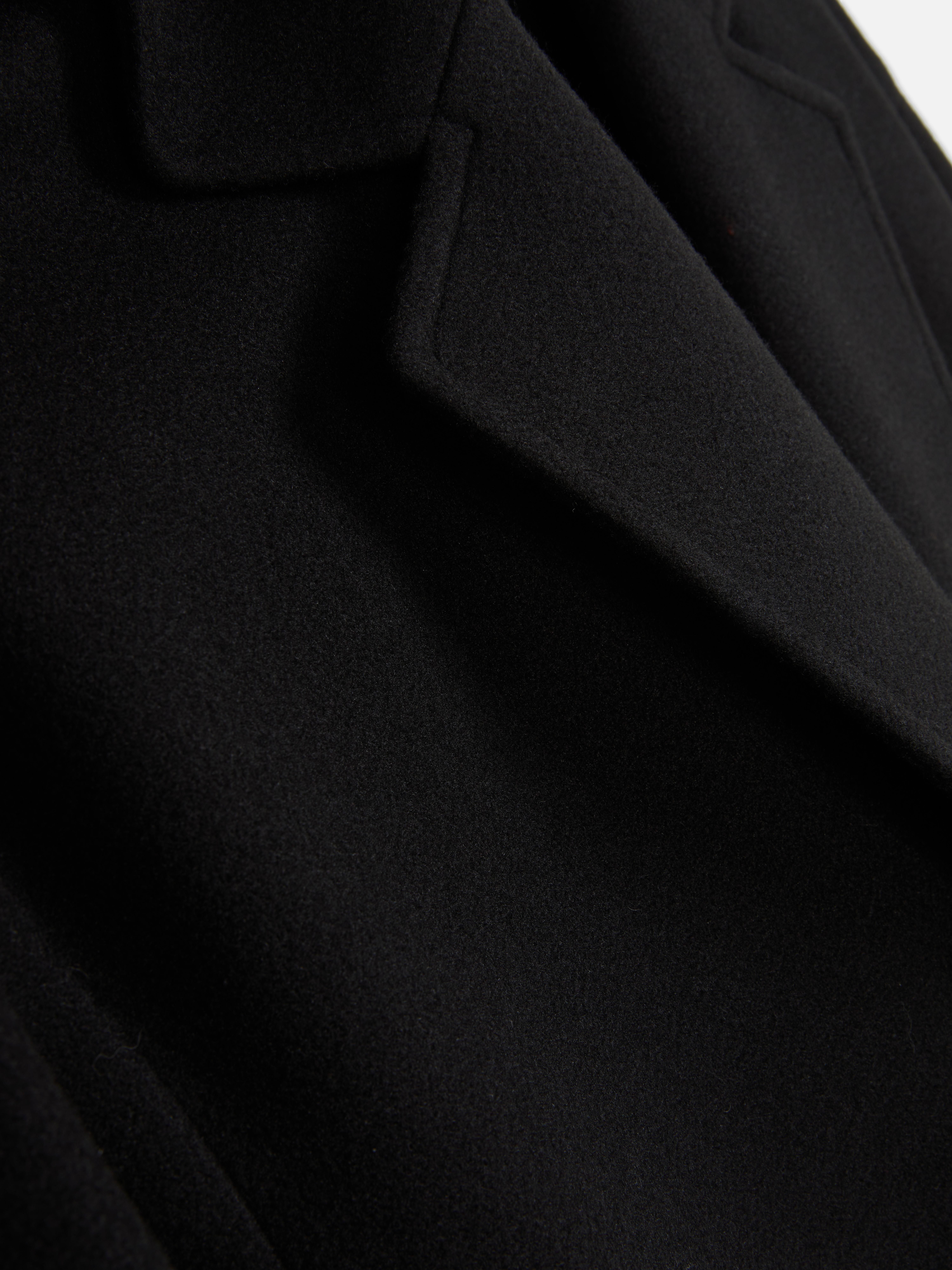 Abrigo midi con botonadura simple