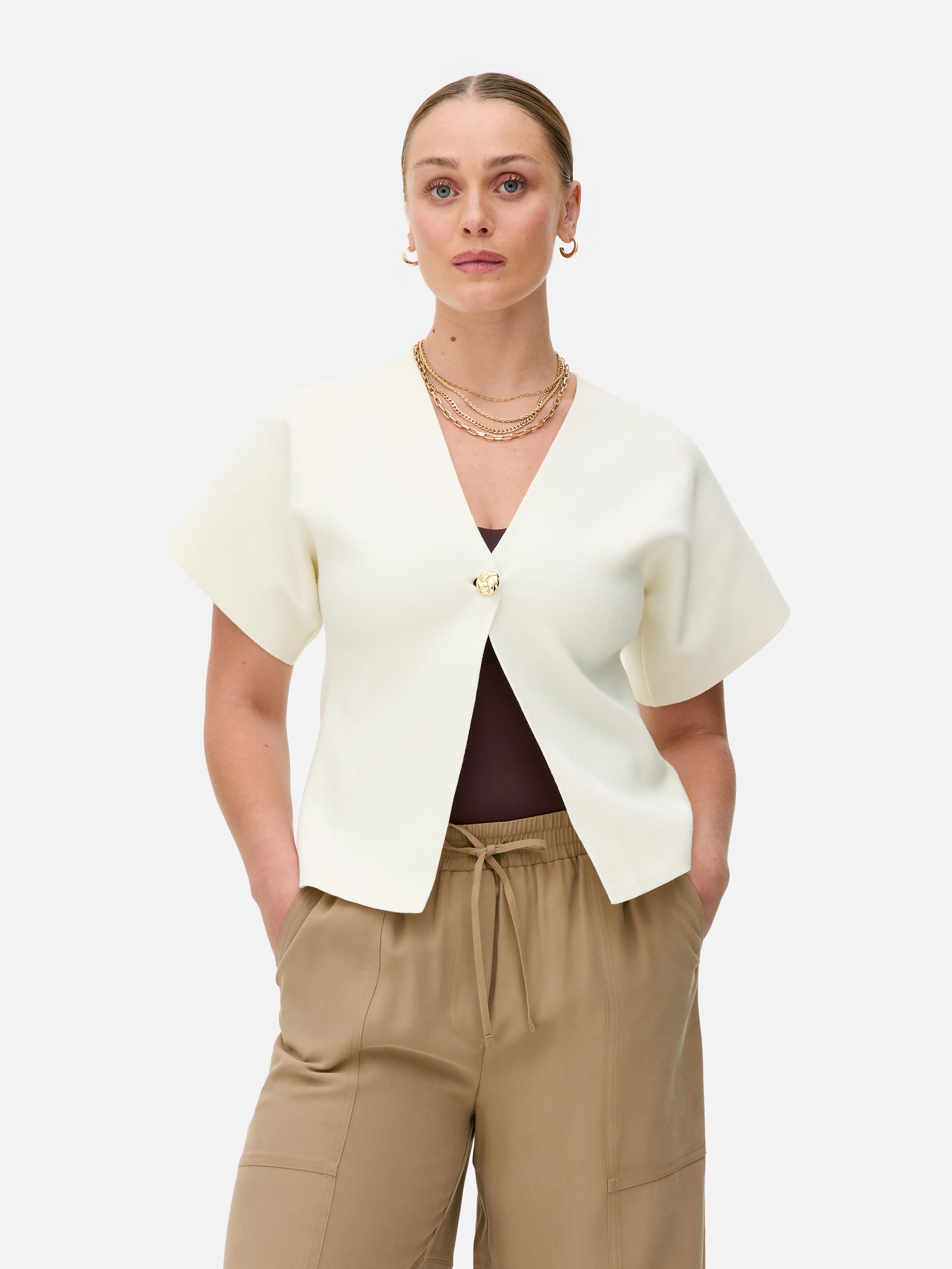 Vest met vleermuismouwen en V-hals