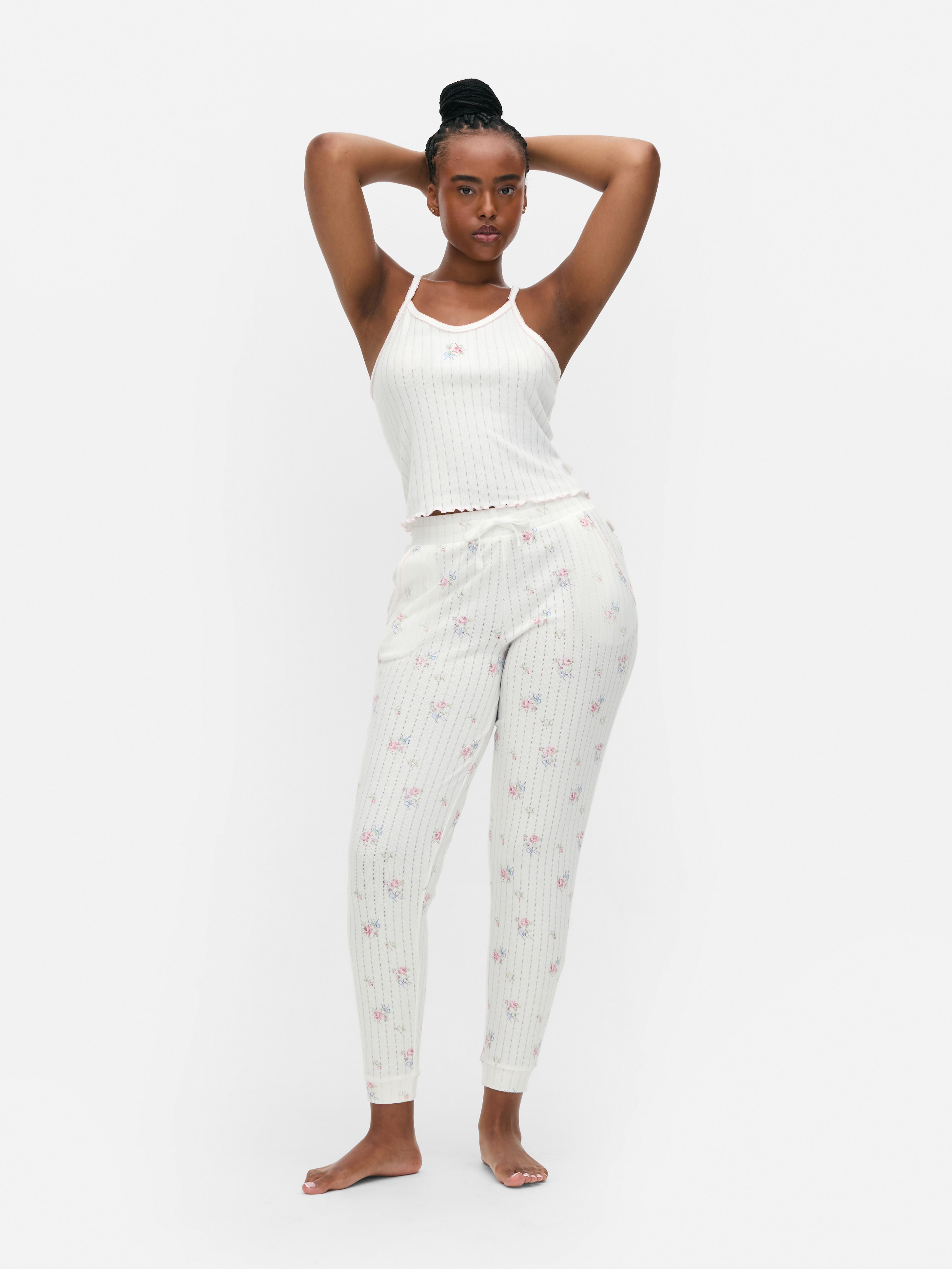 Legging met enkelboorden en opengewerkt bloemmotief