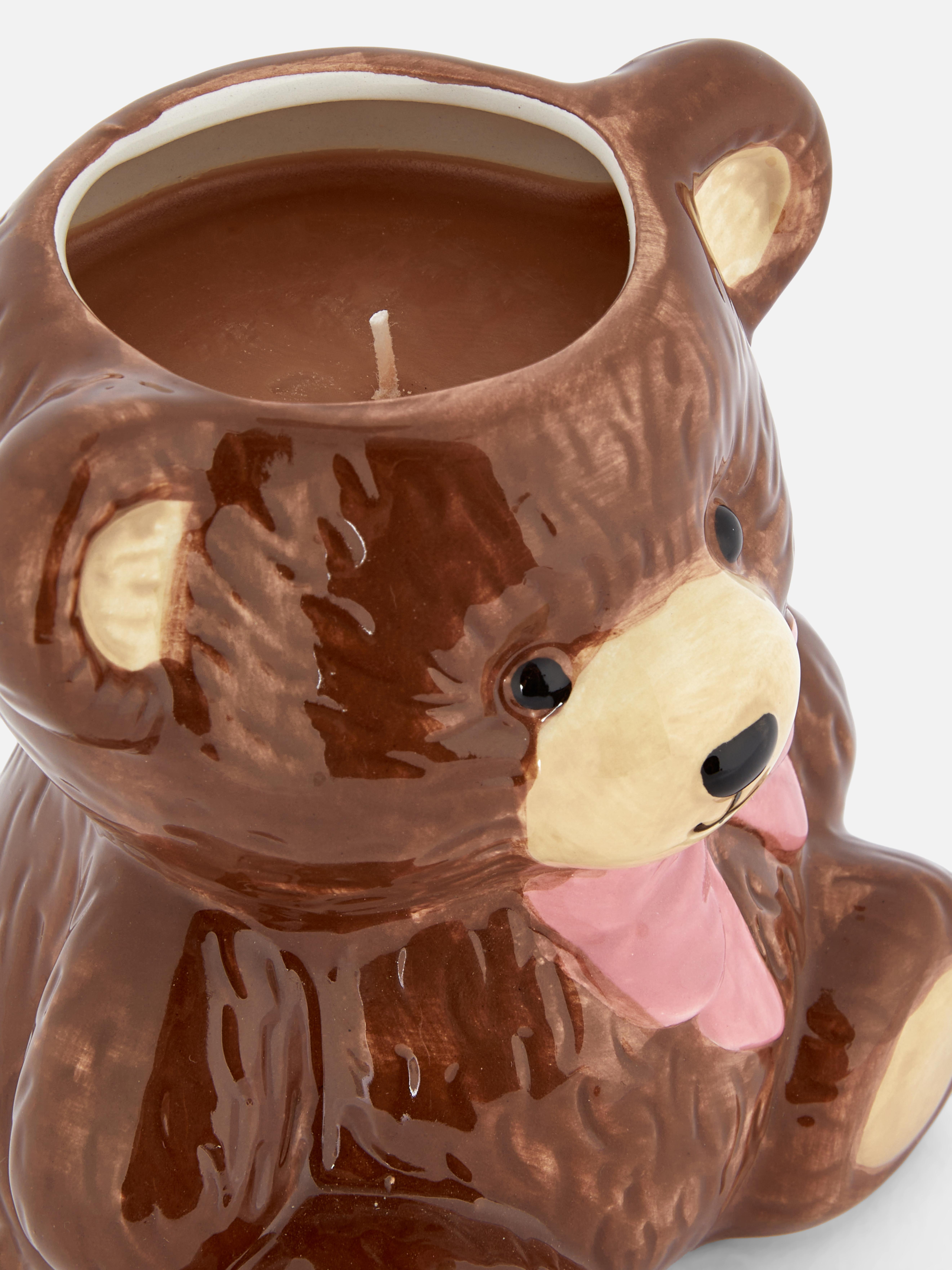 Kerze in teddybärenförmigem Behälter