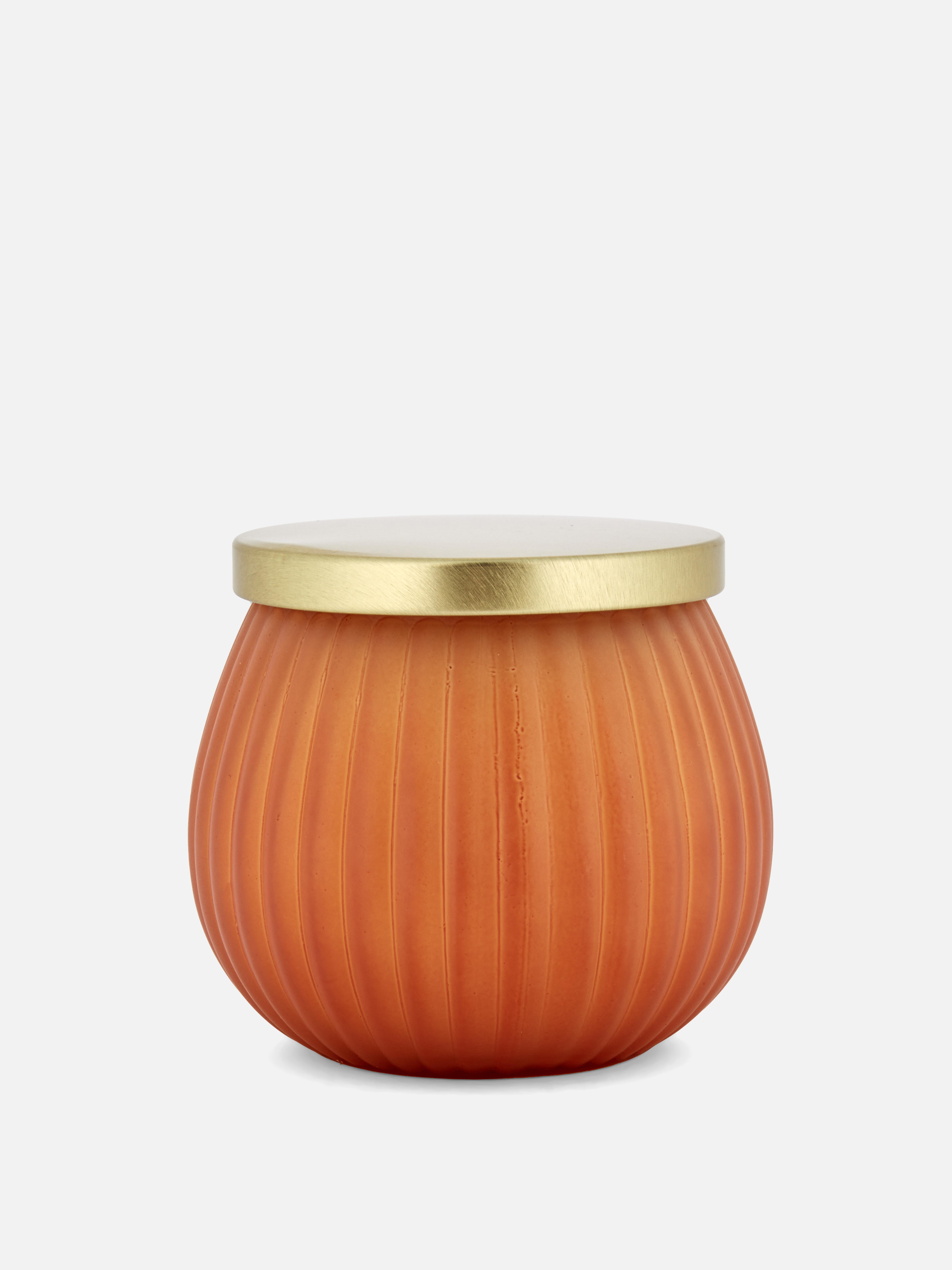 Vela aromática en recipiente de estilo moderno