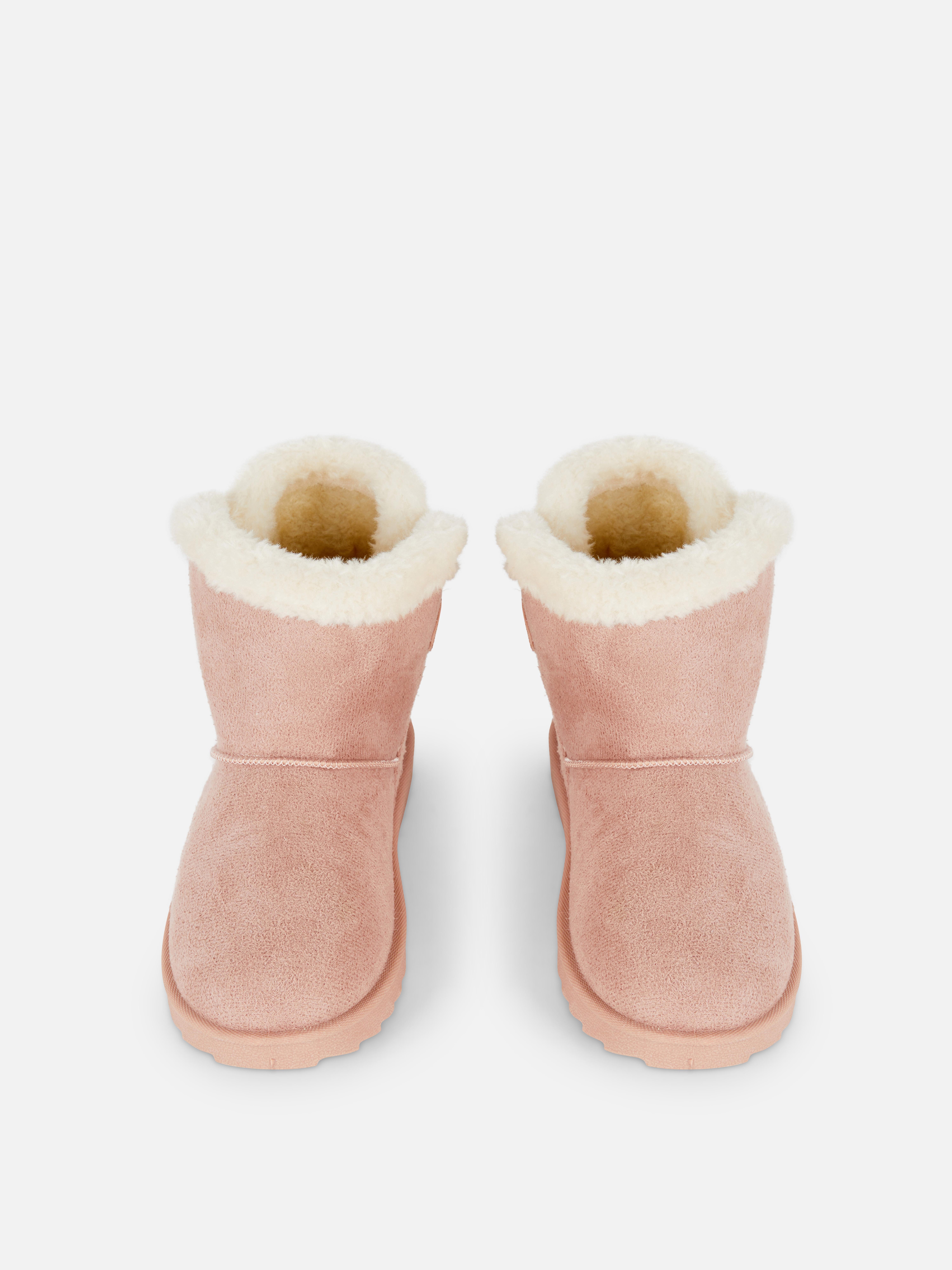 Bottines douillettes à nœud arrière