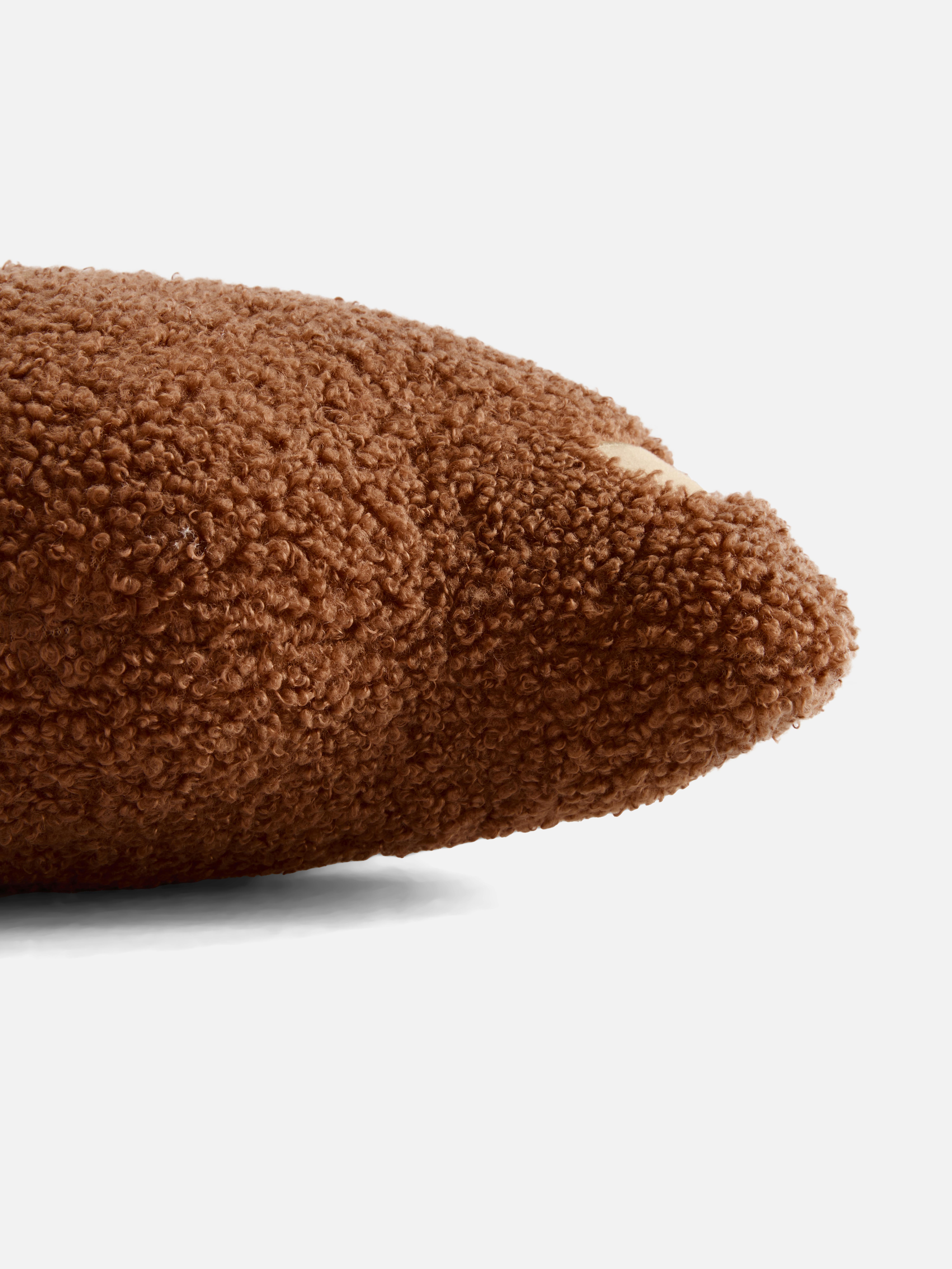 Bouclé-Kissen in Bärenform