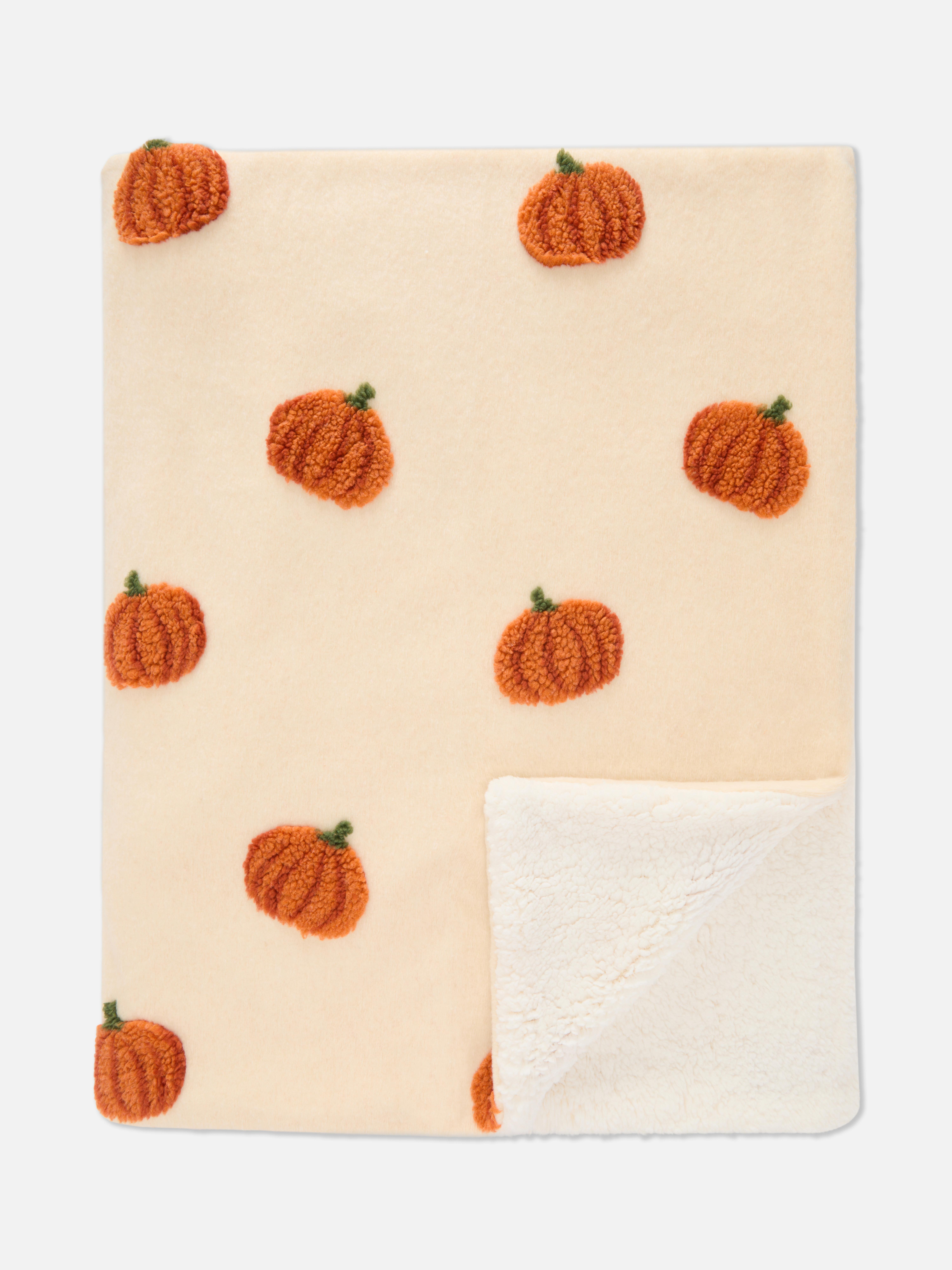 Manta de bouclé con calabazas