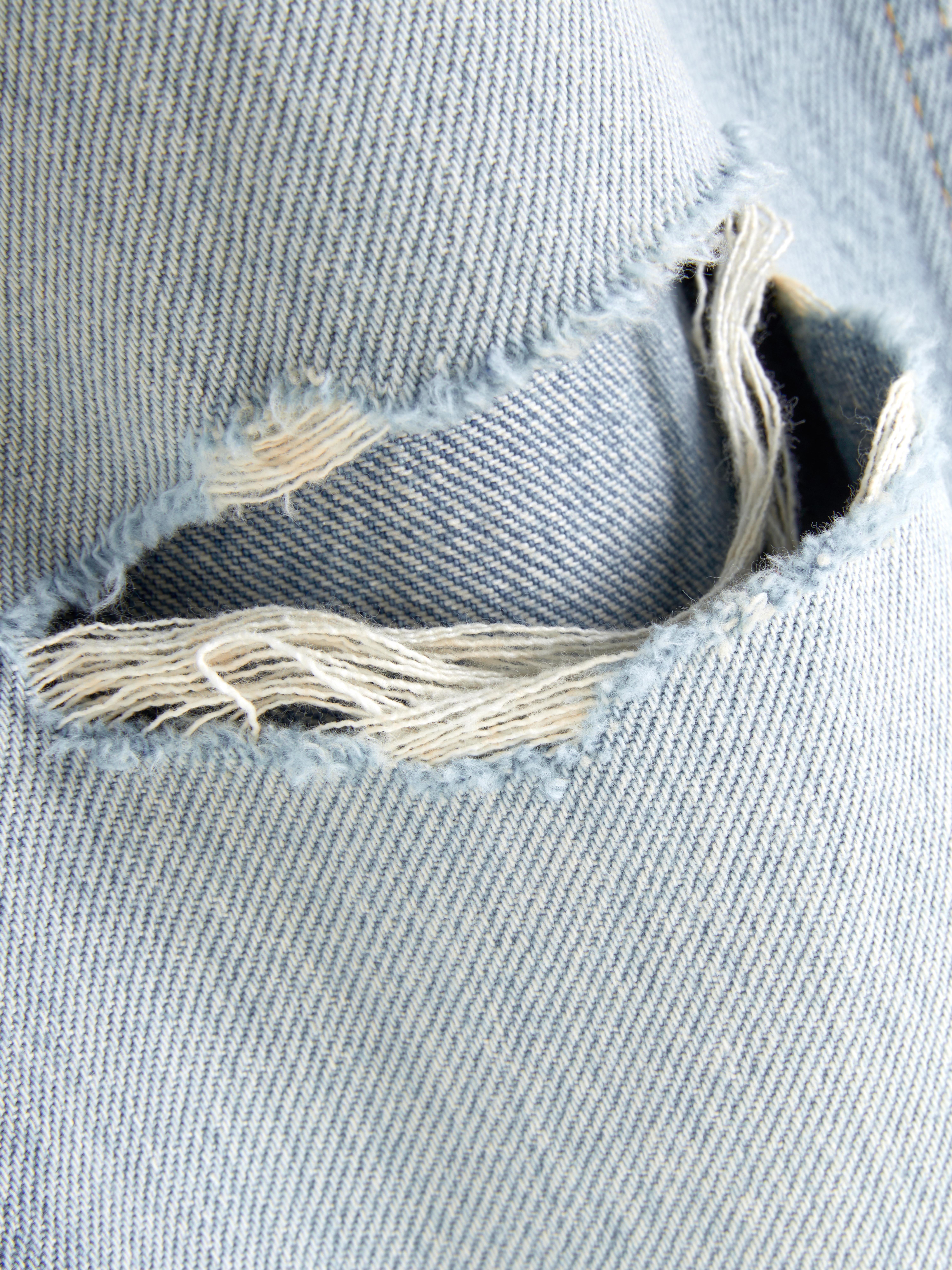 Mid Rise Ripped Straight Leg Jeans