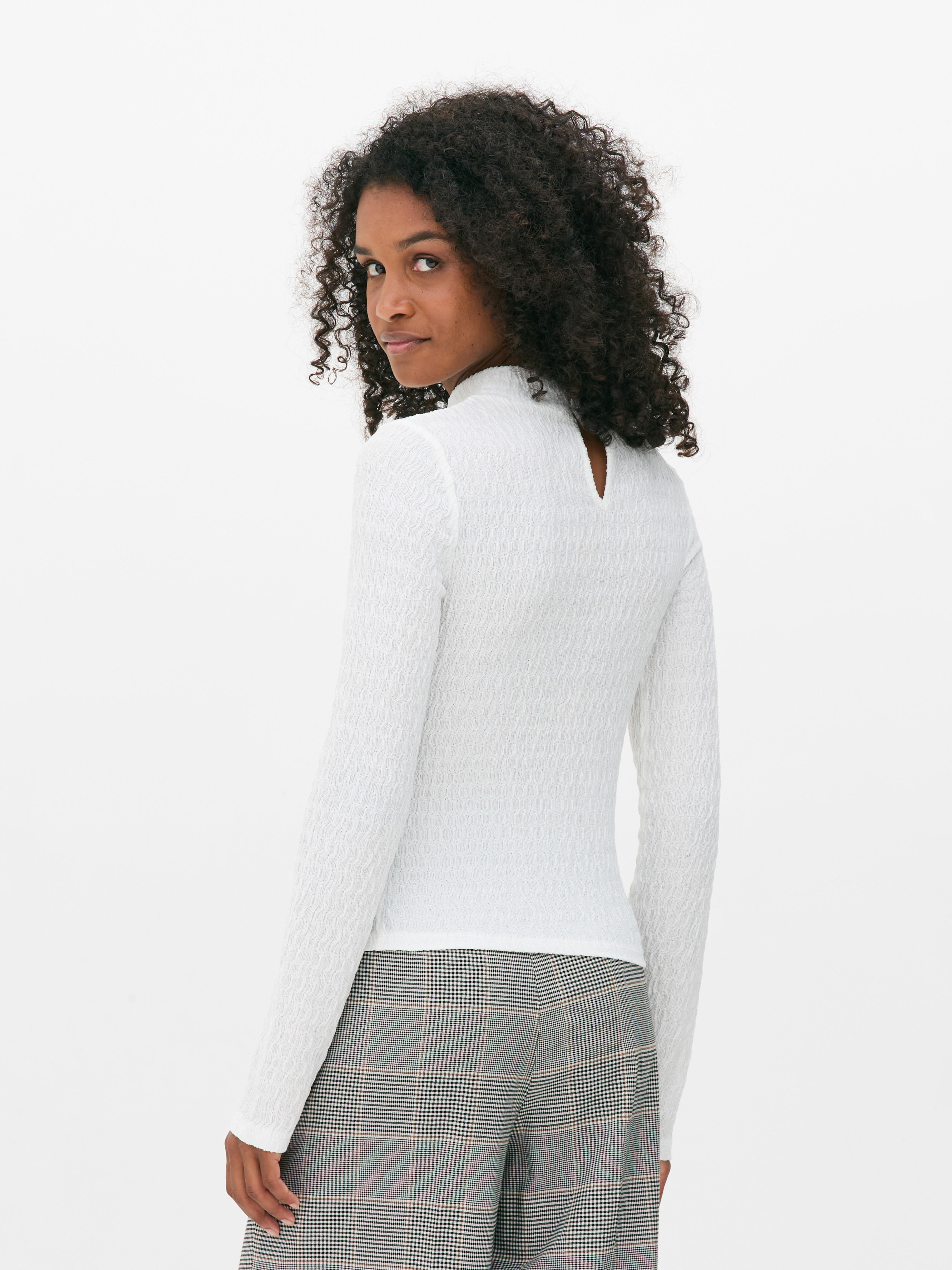 Top met hoge hals en textuur