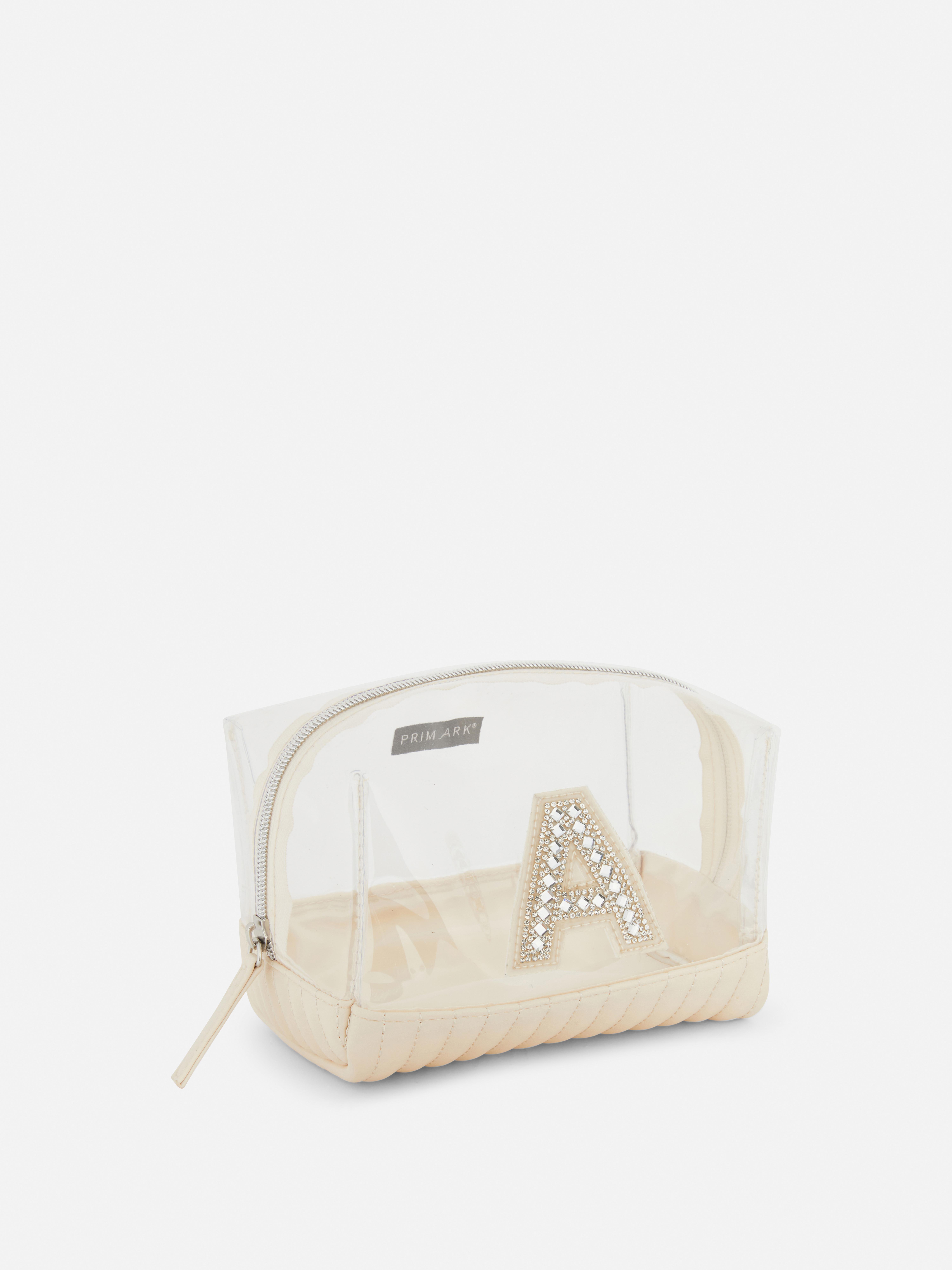 Bolsa de maquillaje de plexiglás con inicial