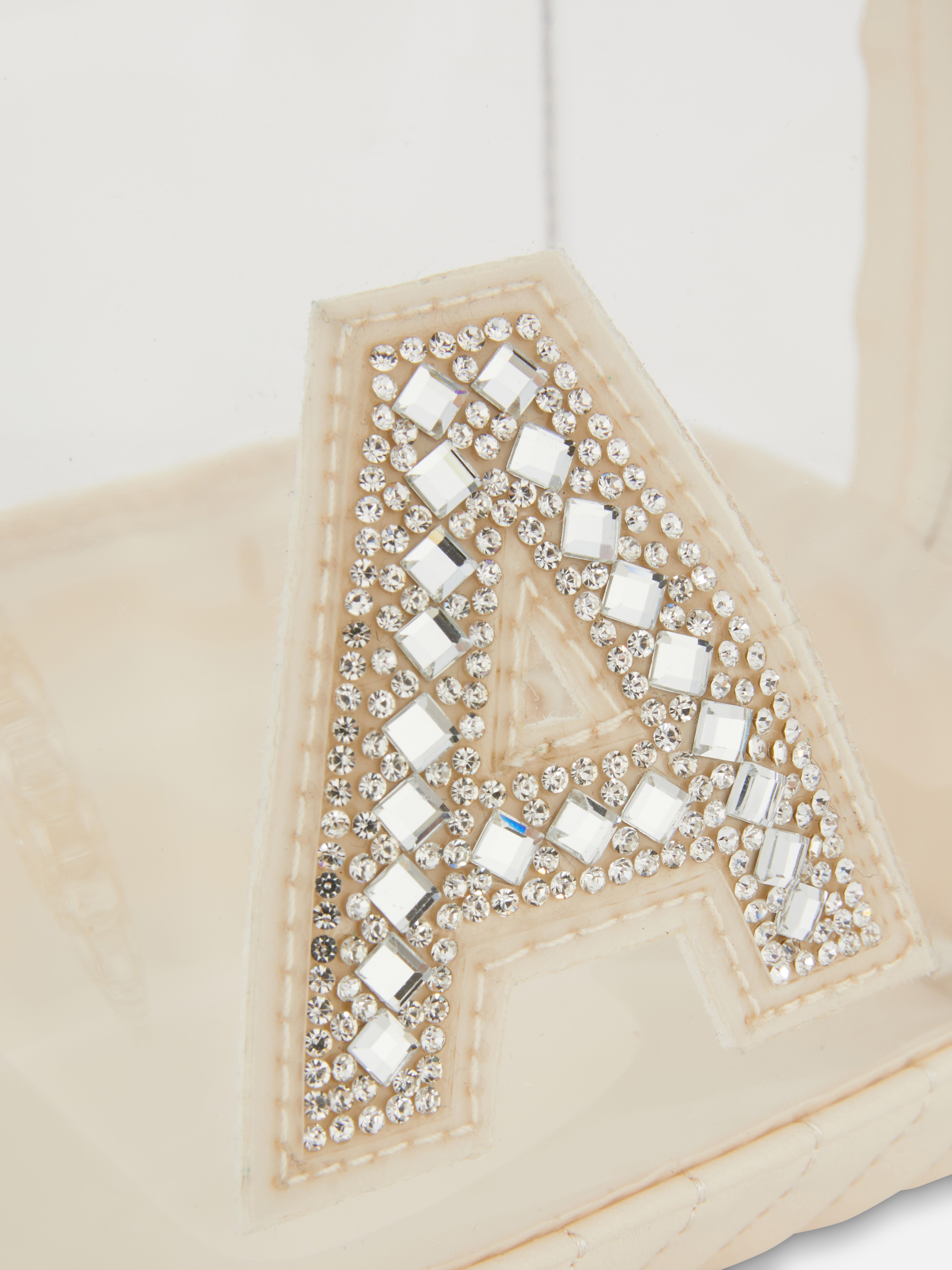 Bolsa de maquillaje de plexiglás con inicial