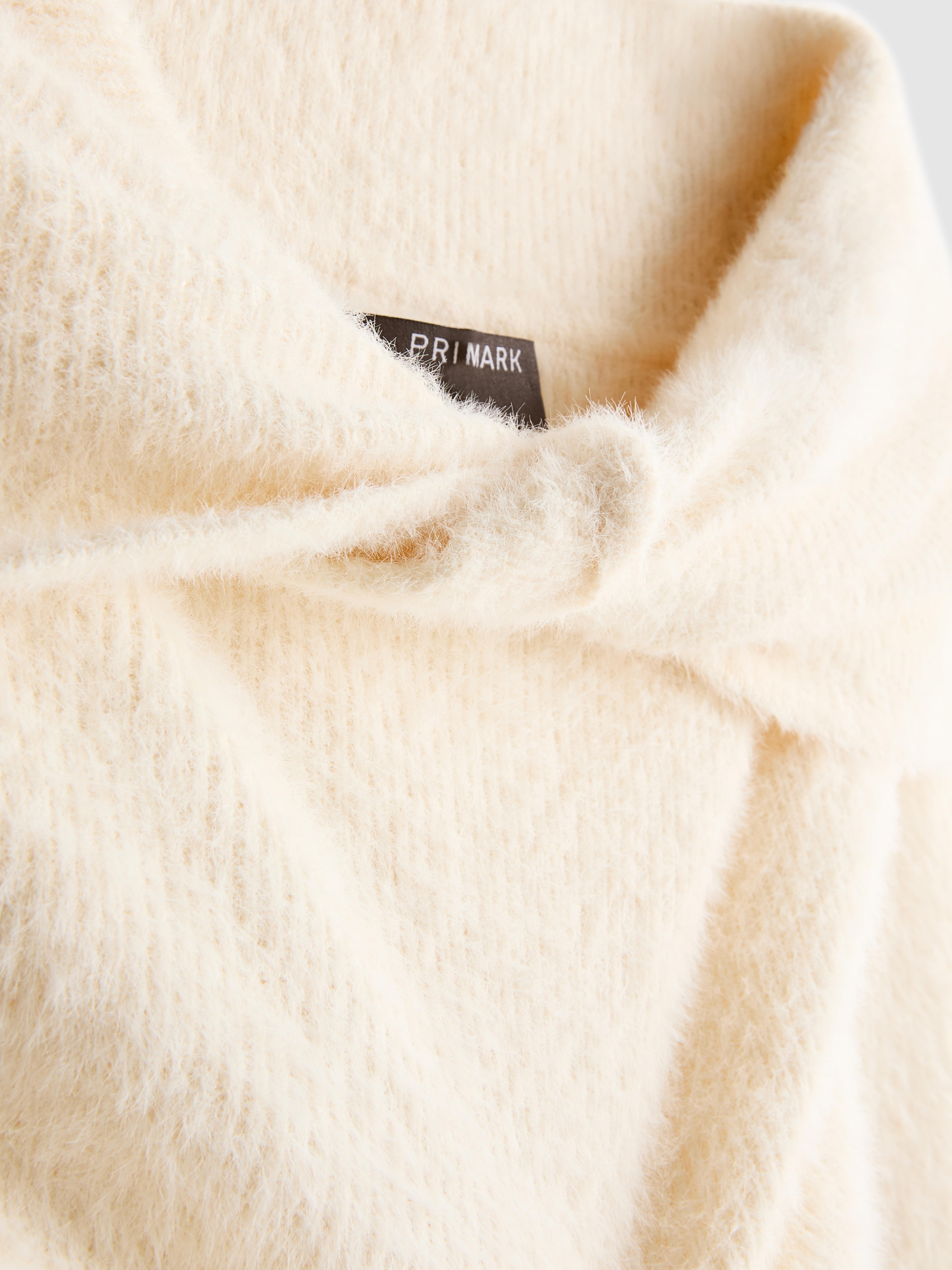 Pull à encolure bateau et finitions torsadées