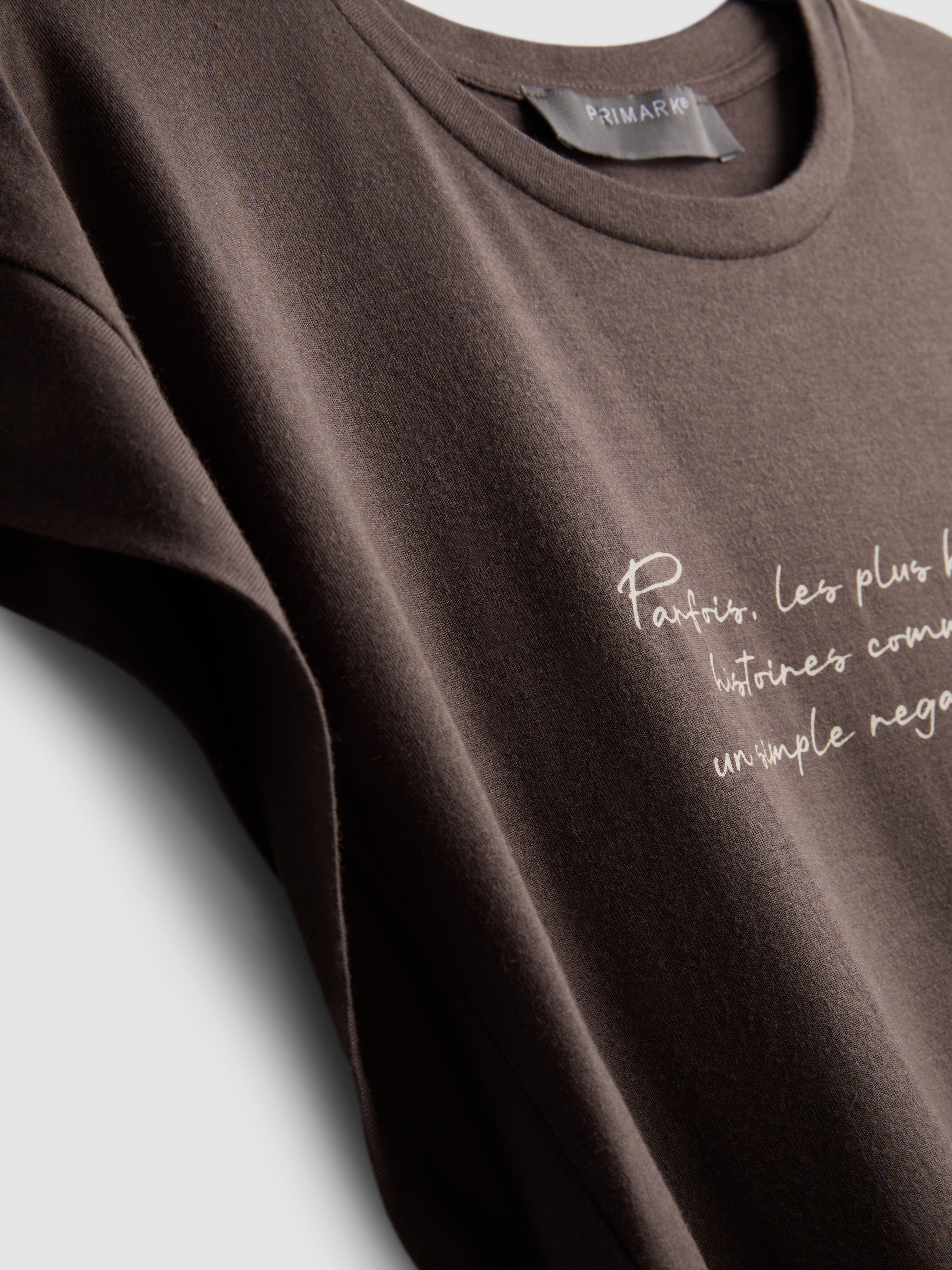 T-shirt comprida bainha curva