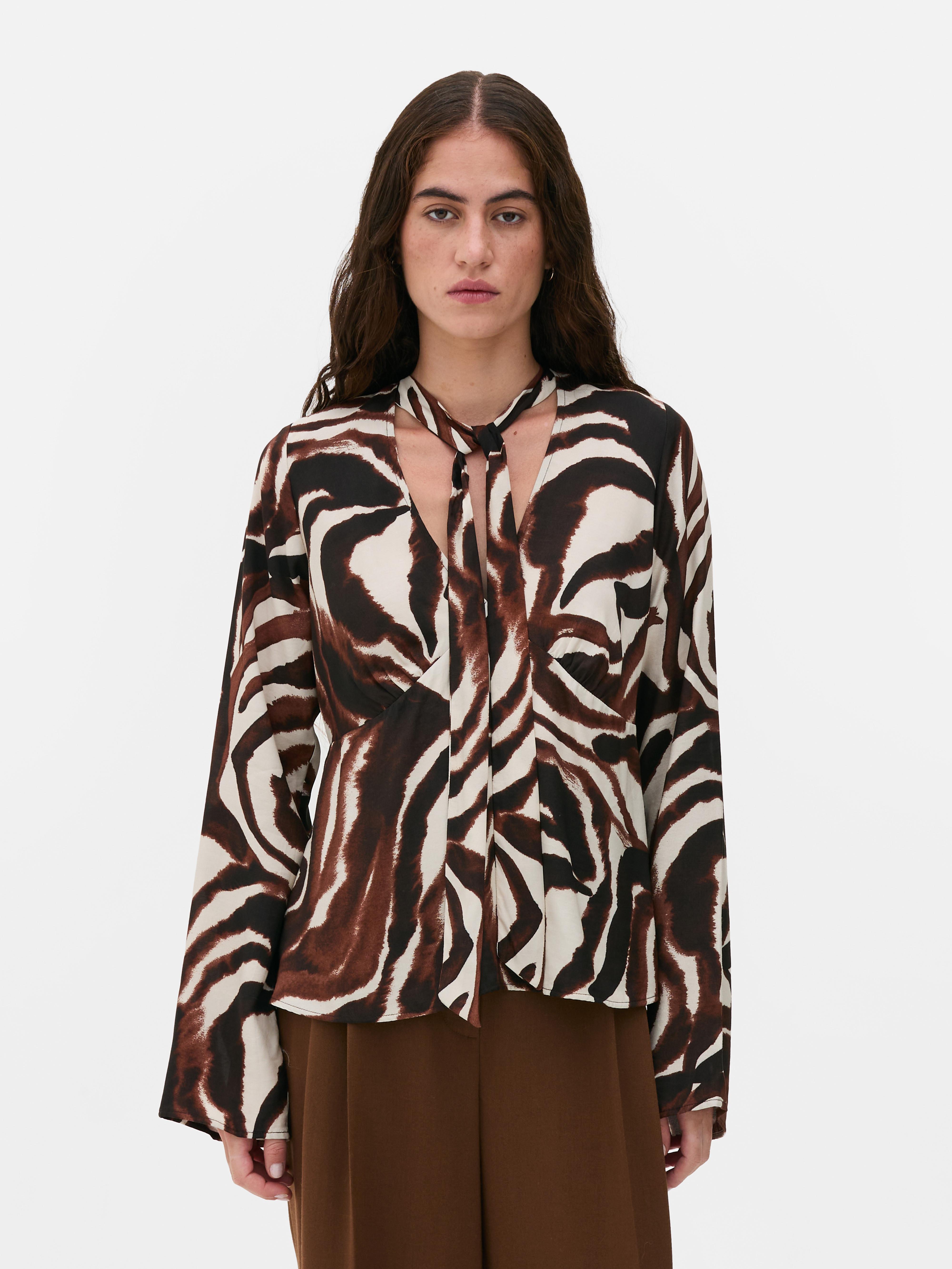 Blusa atilhos pescoço zebra