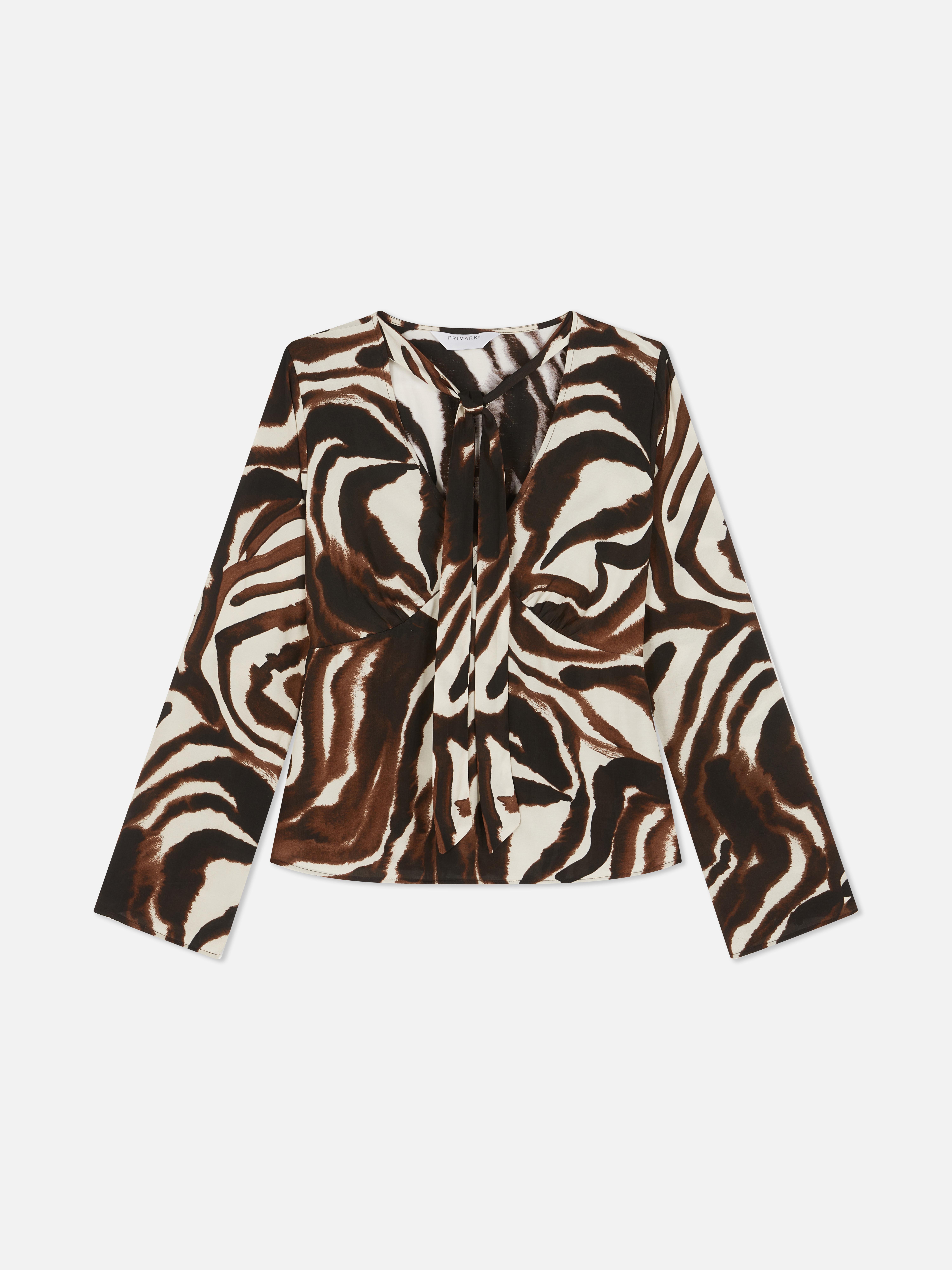 Blusa atilhos pescoço zebra