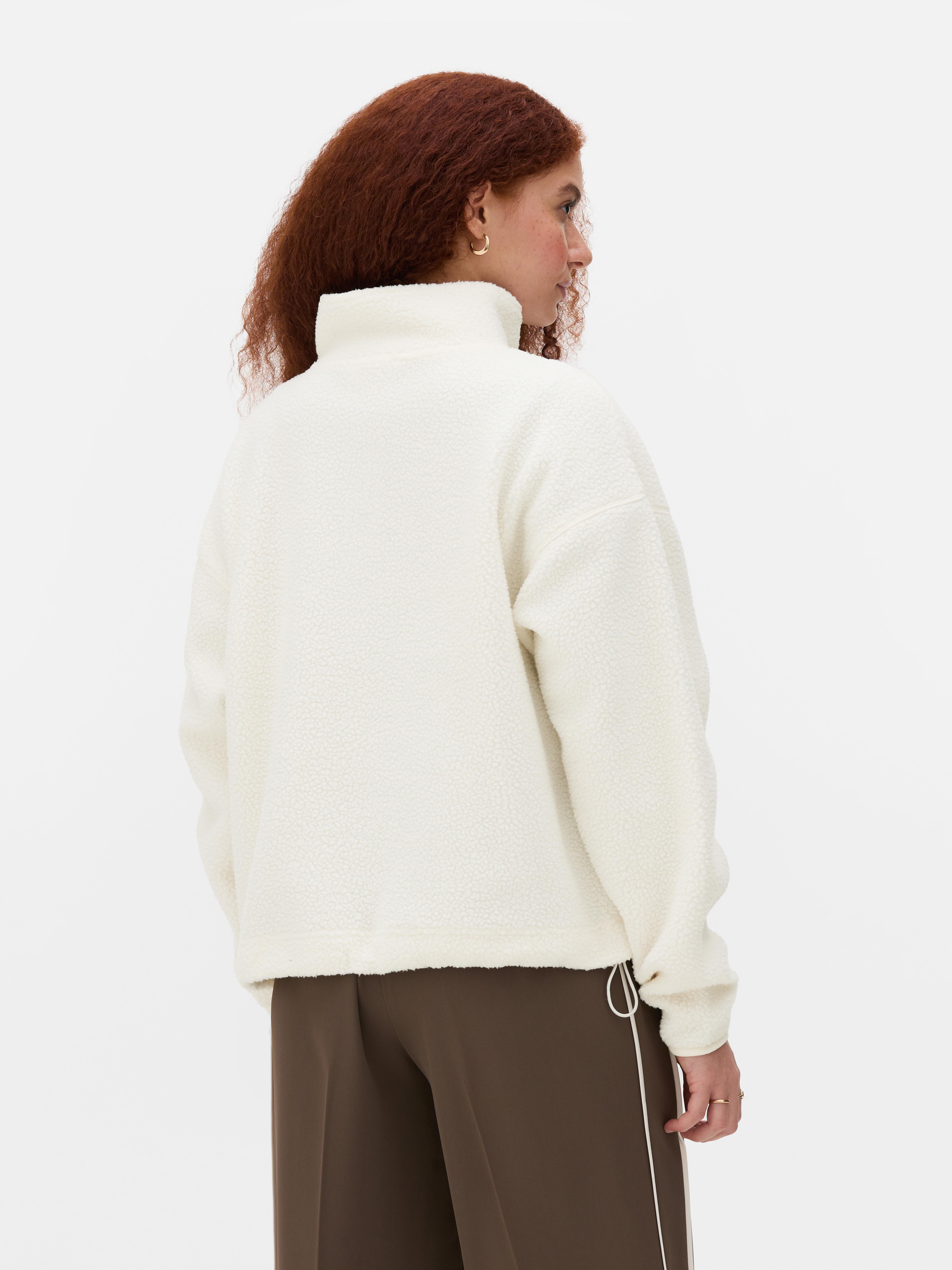 Fleece van borgstof met halve rits