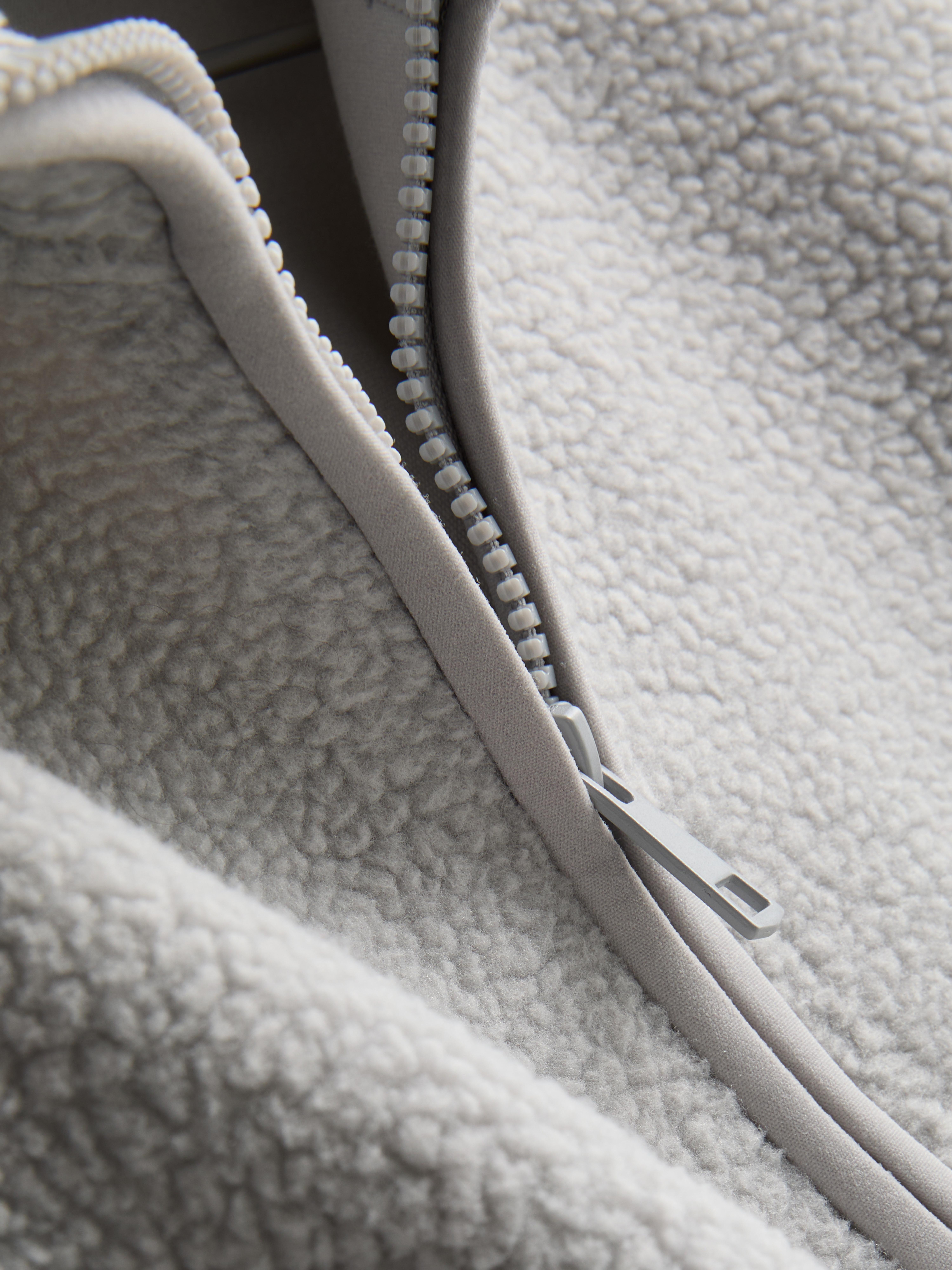 Forro polar de borreguito con media cremallera