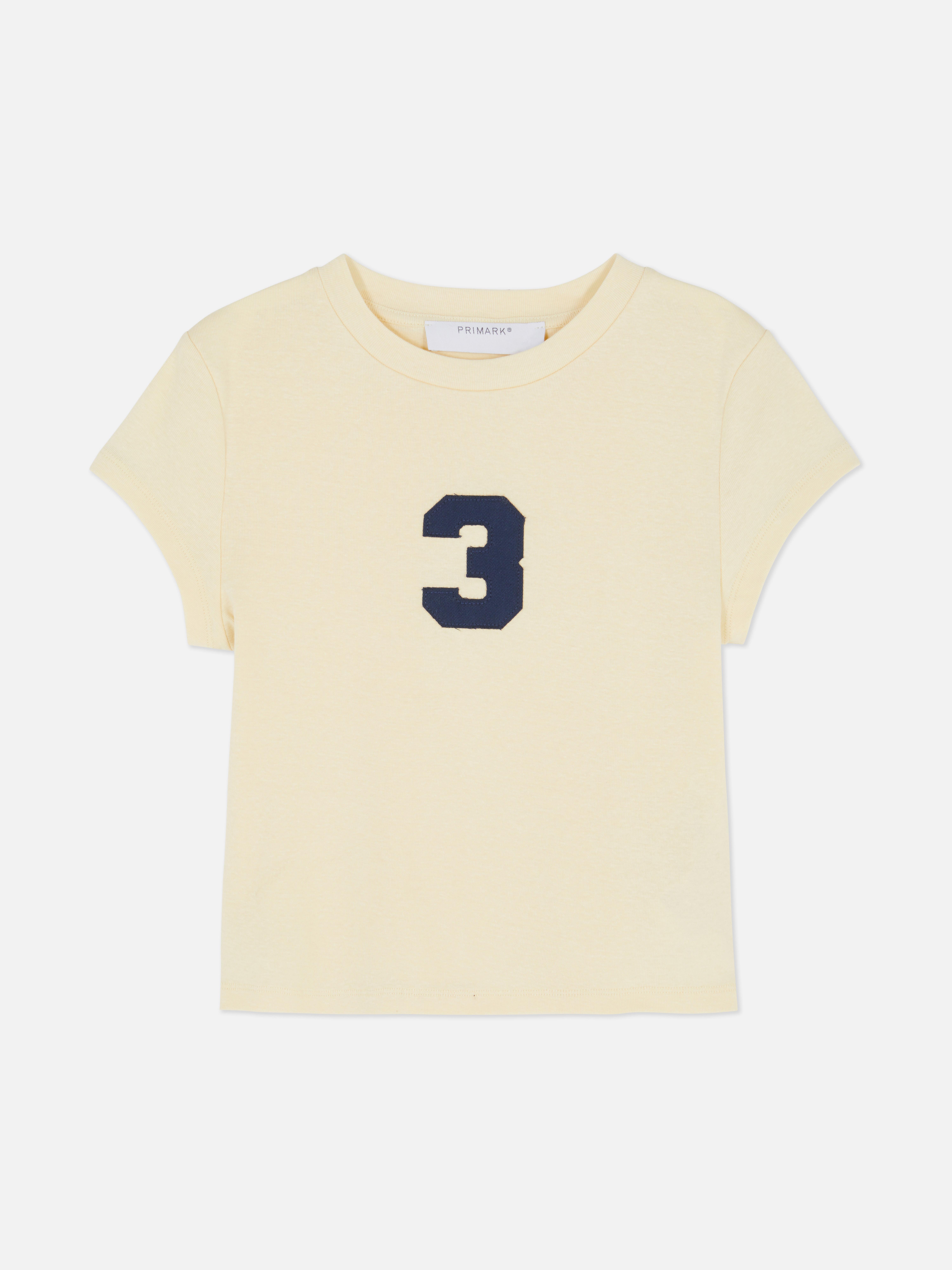 T-shirt curto emblema aplique