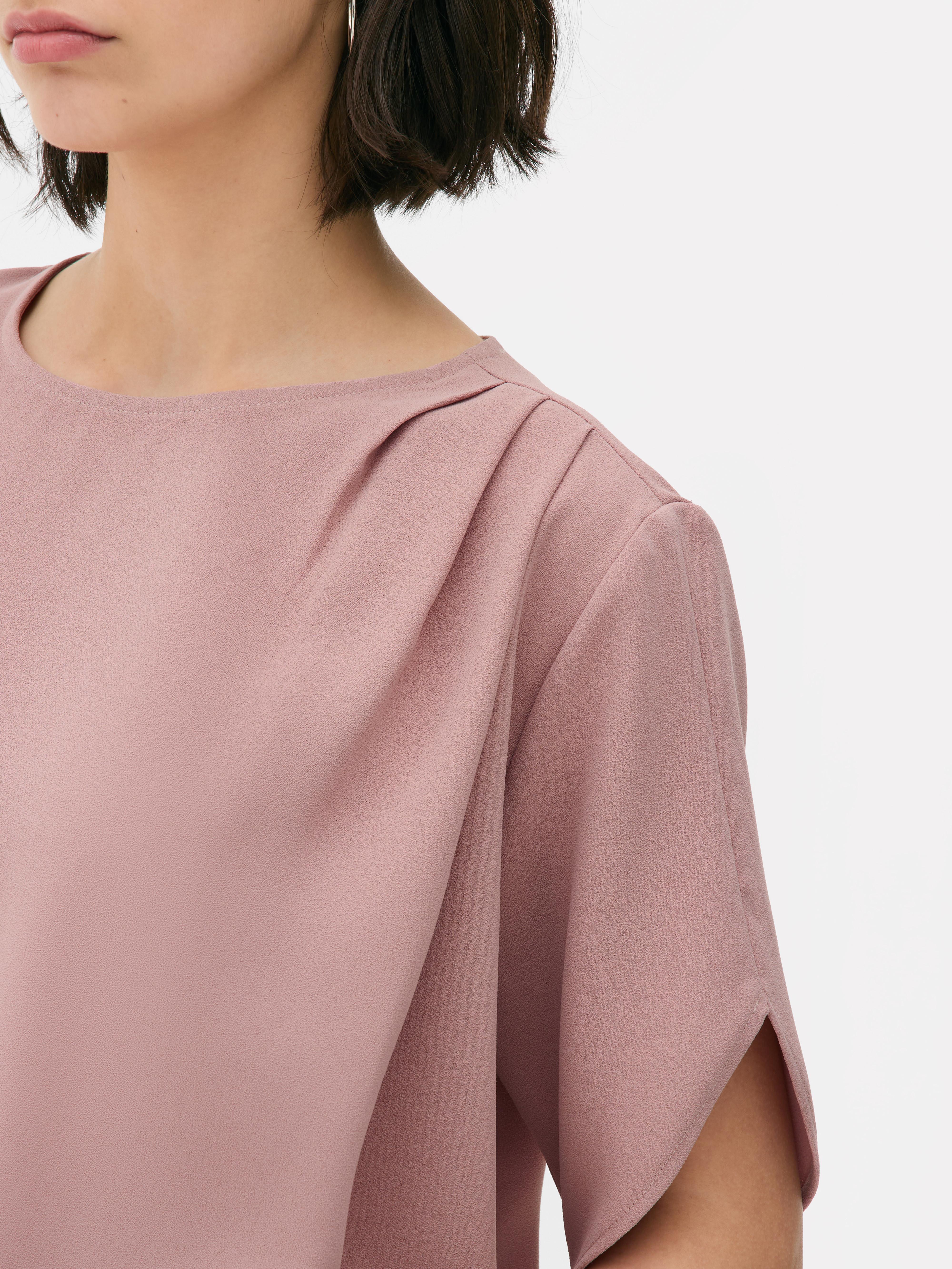 Blusa mangas folgadas