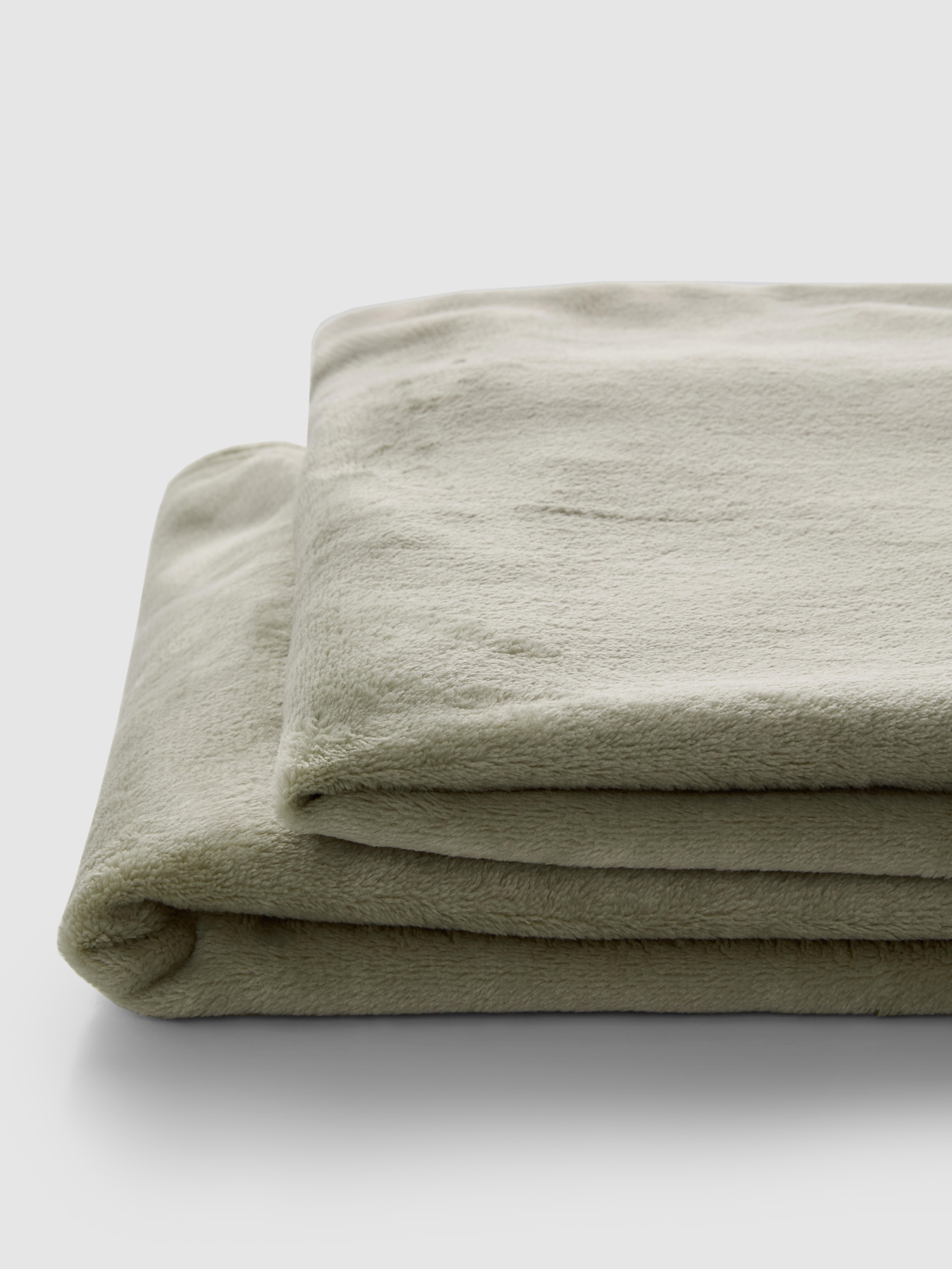 Zachte deken met kwastjes