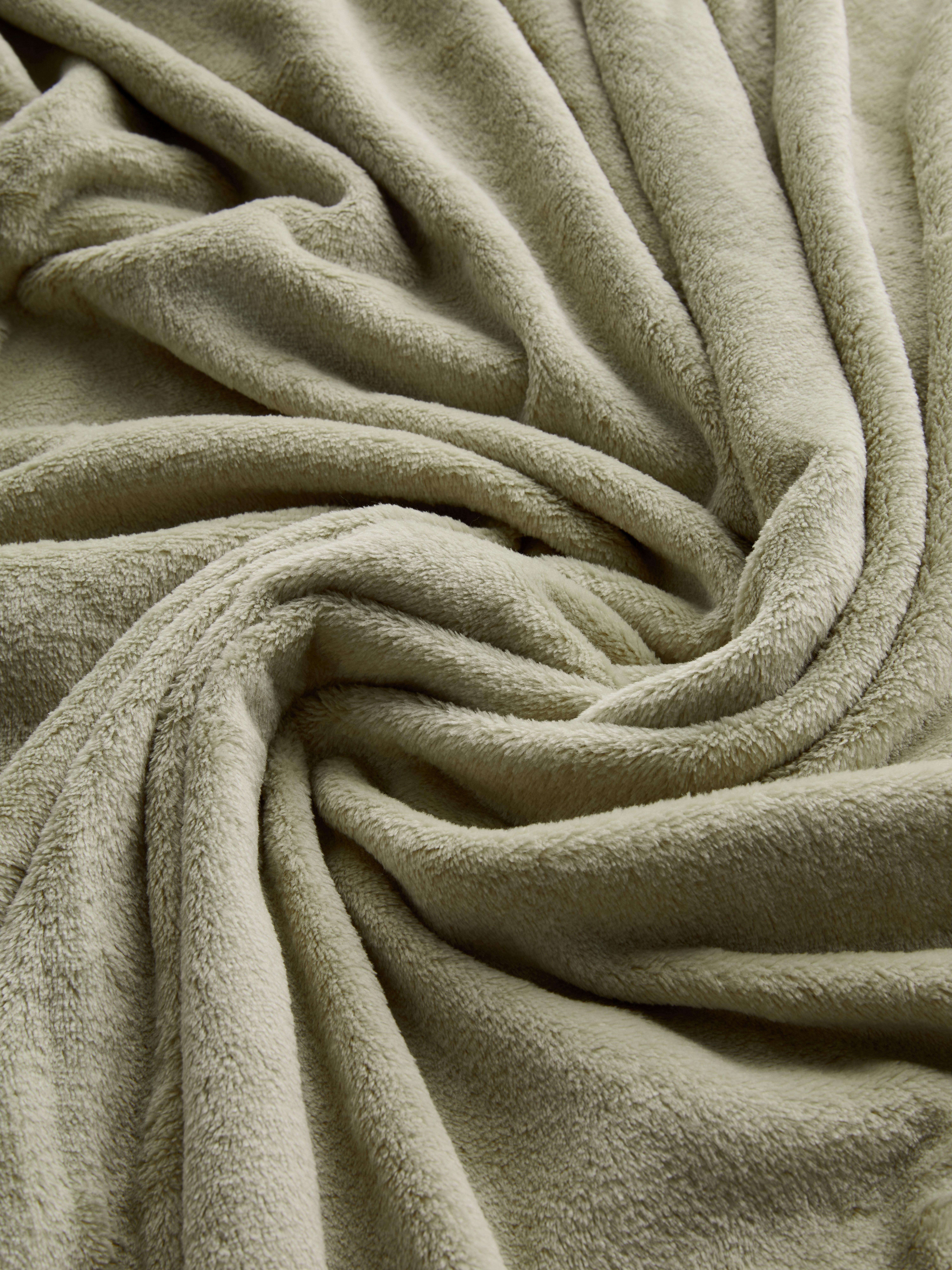 Zachte deken met kwastjes