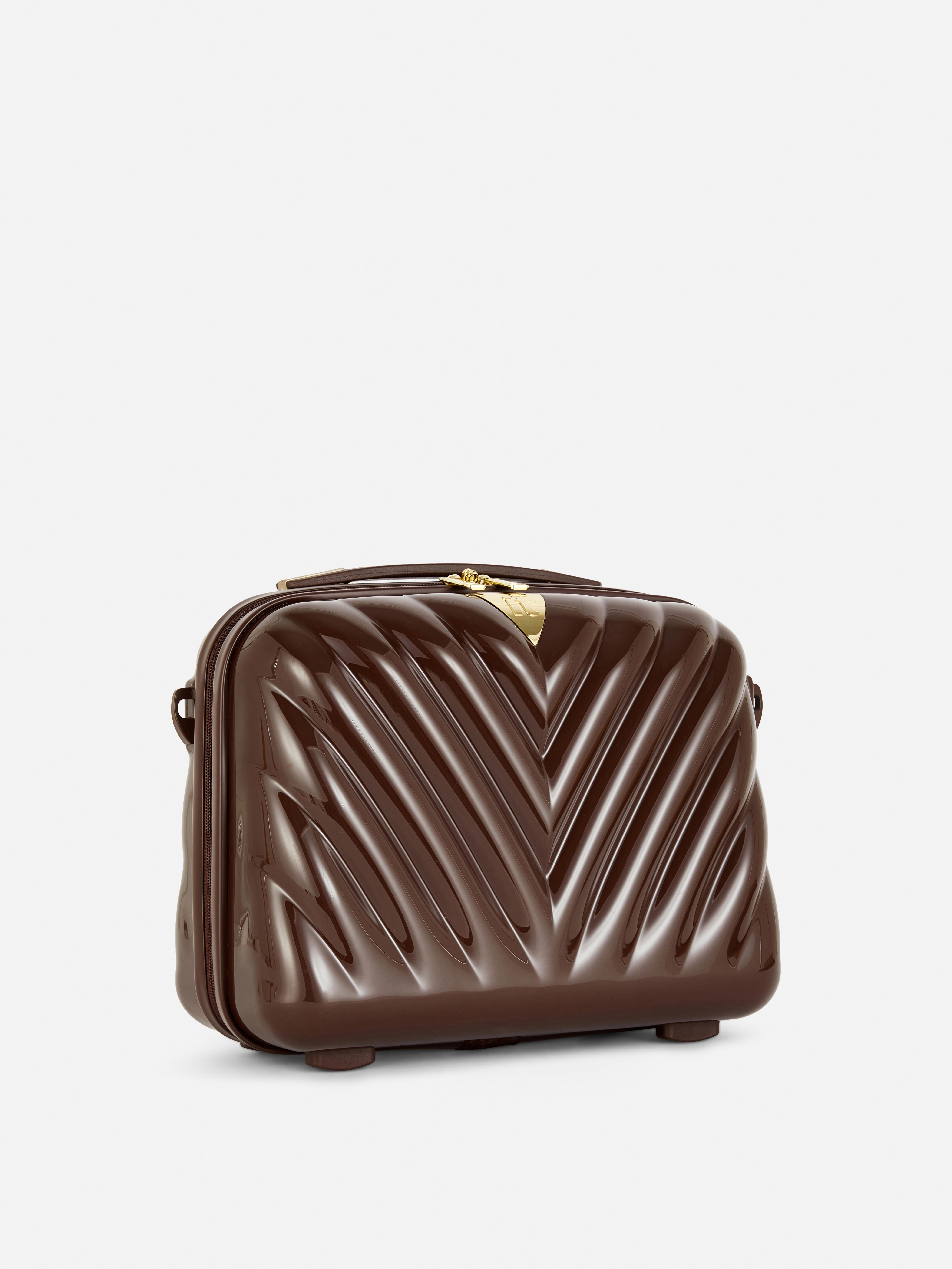 Estuche de maquillaje rígido de espiga de It Luggage