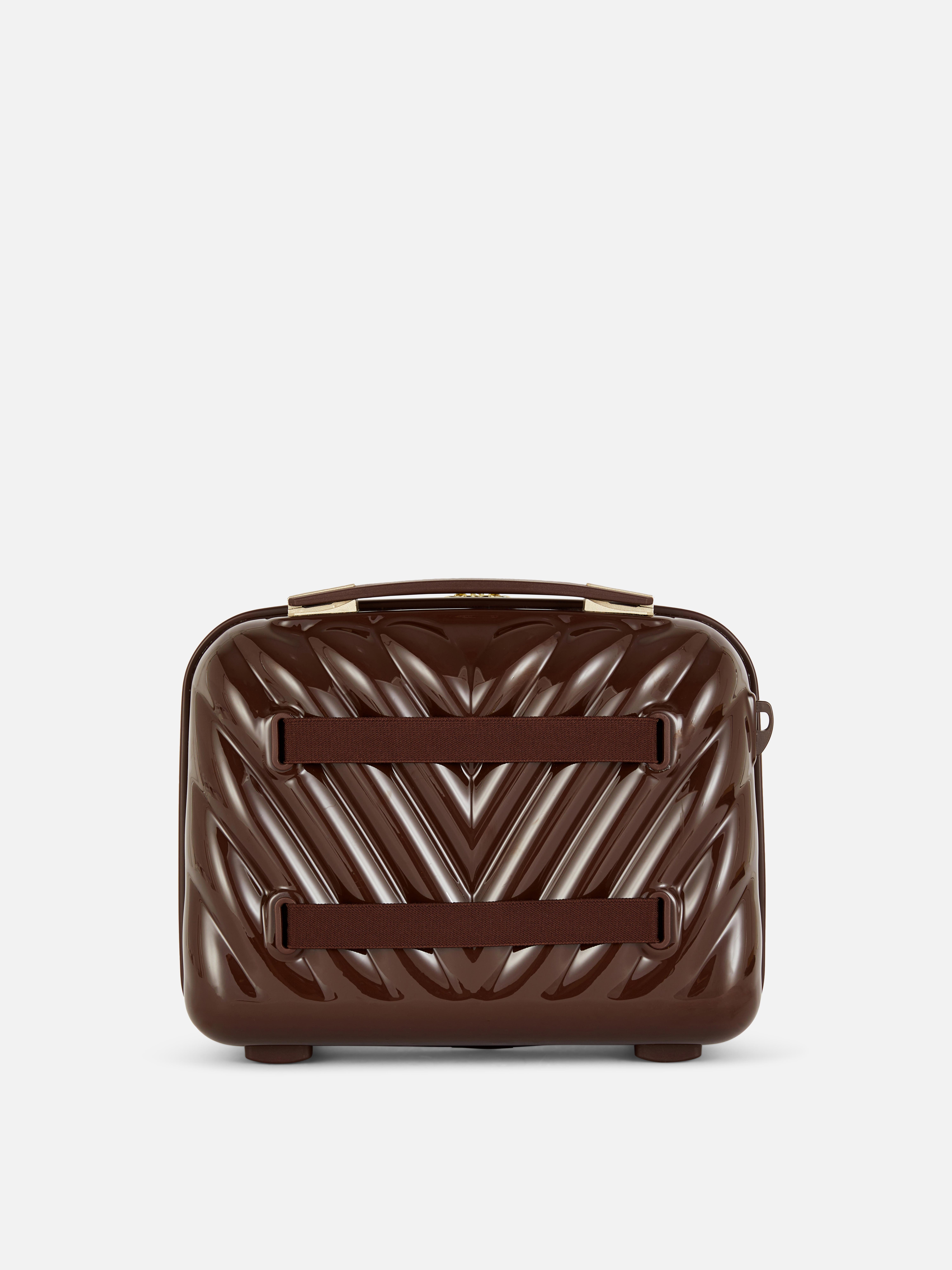 Estuche de maquillaje rígido de espiga de It Luggage