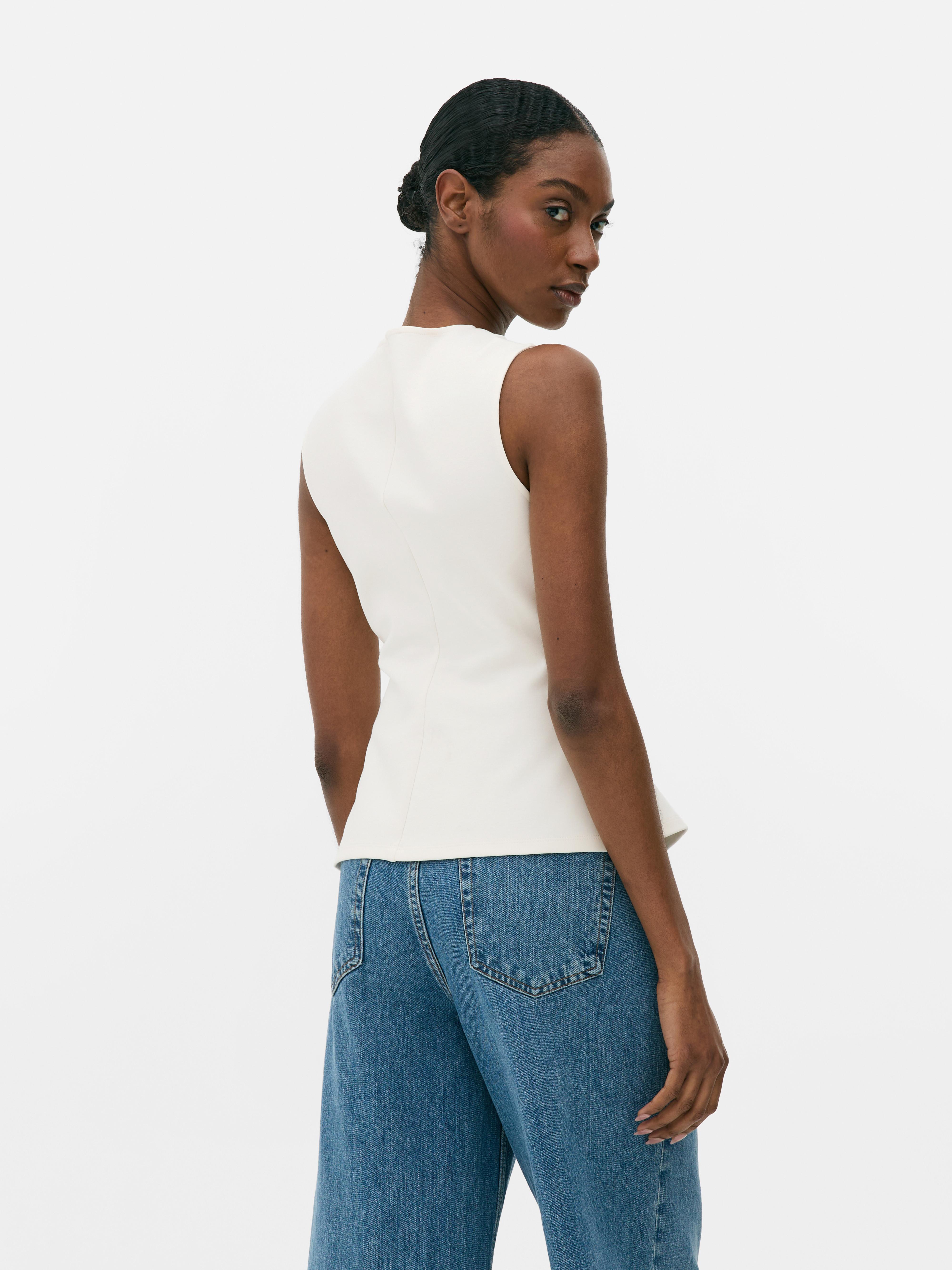 Top peplum con lazos