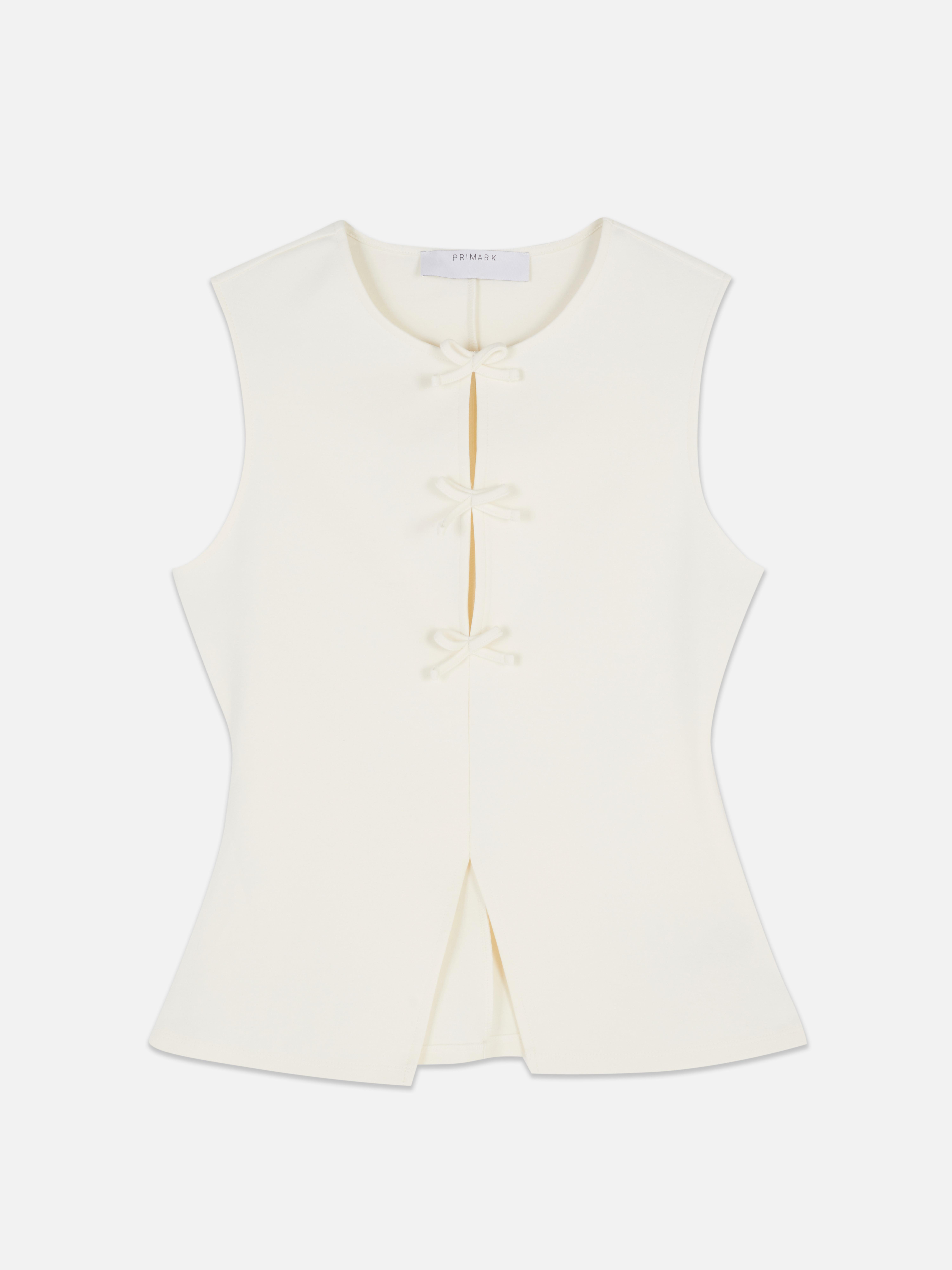 Top peplum con lazos