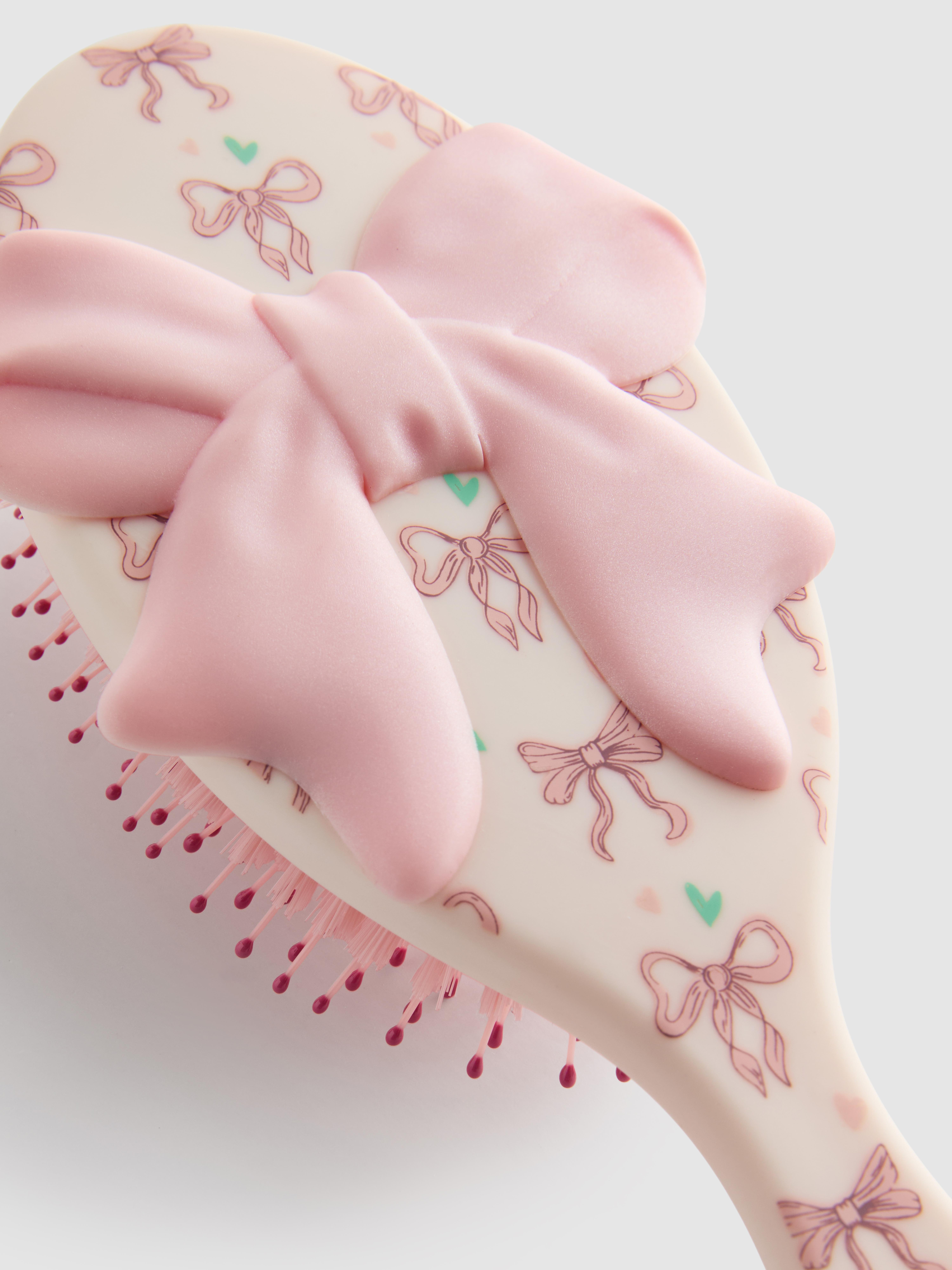 PS... Glättende Haarbürste mit Schleifenprint