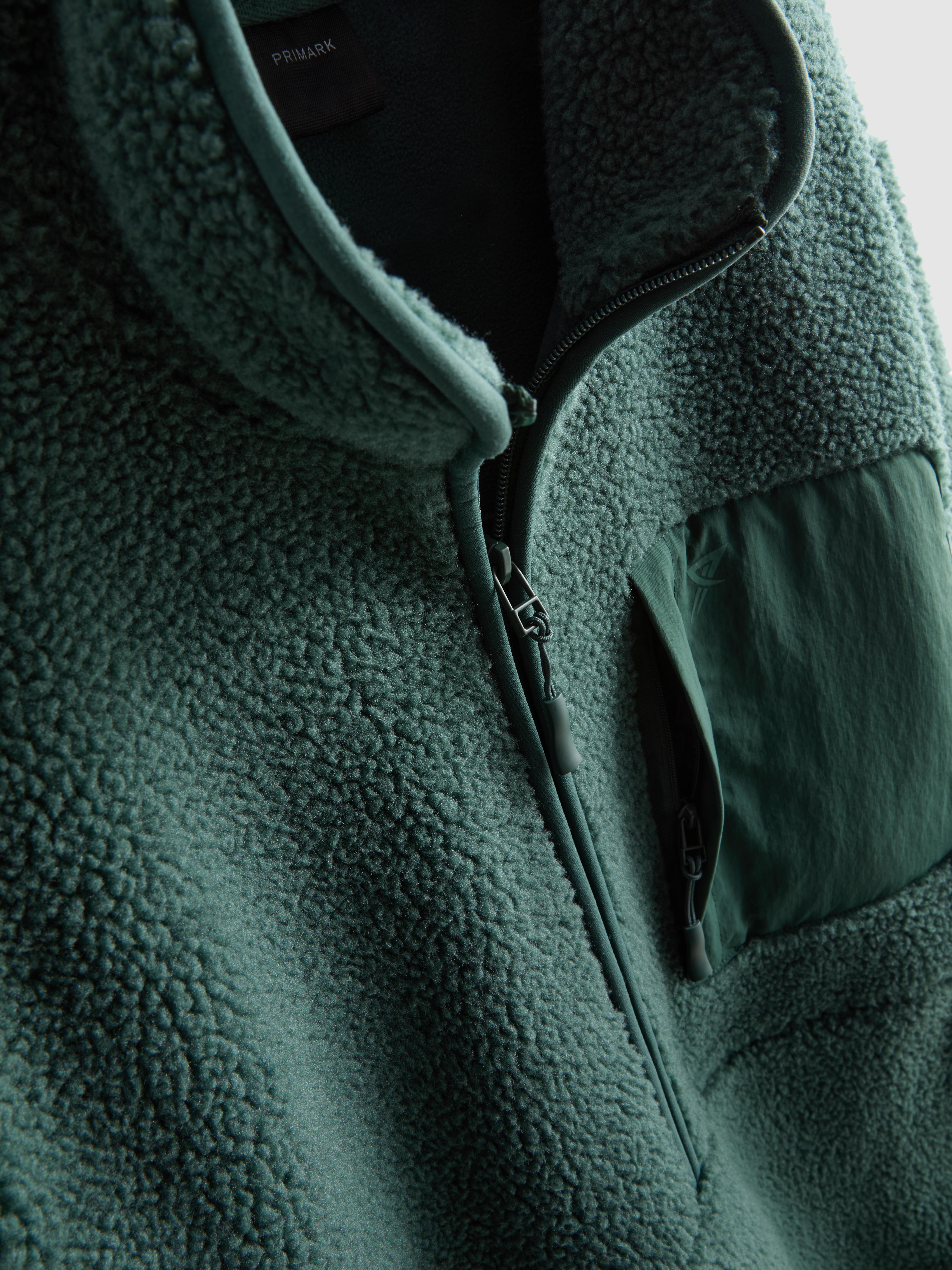 Kożuszkowy polar z zapięciem na suwak 1/2