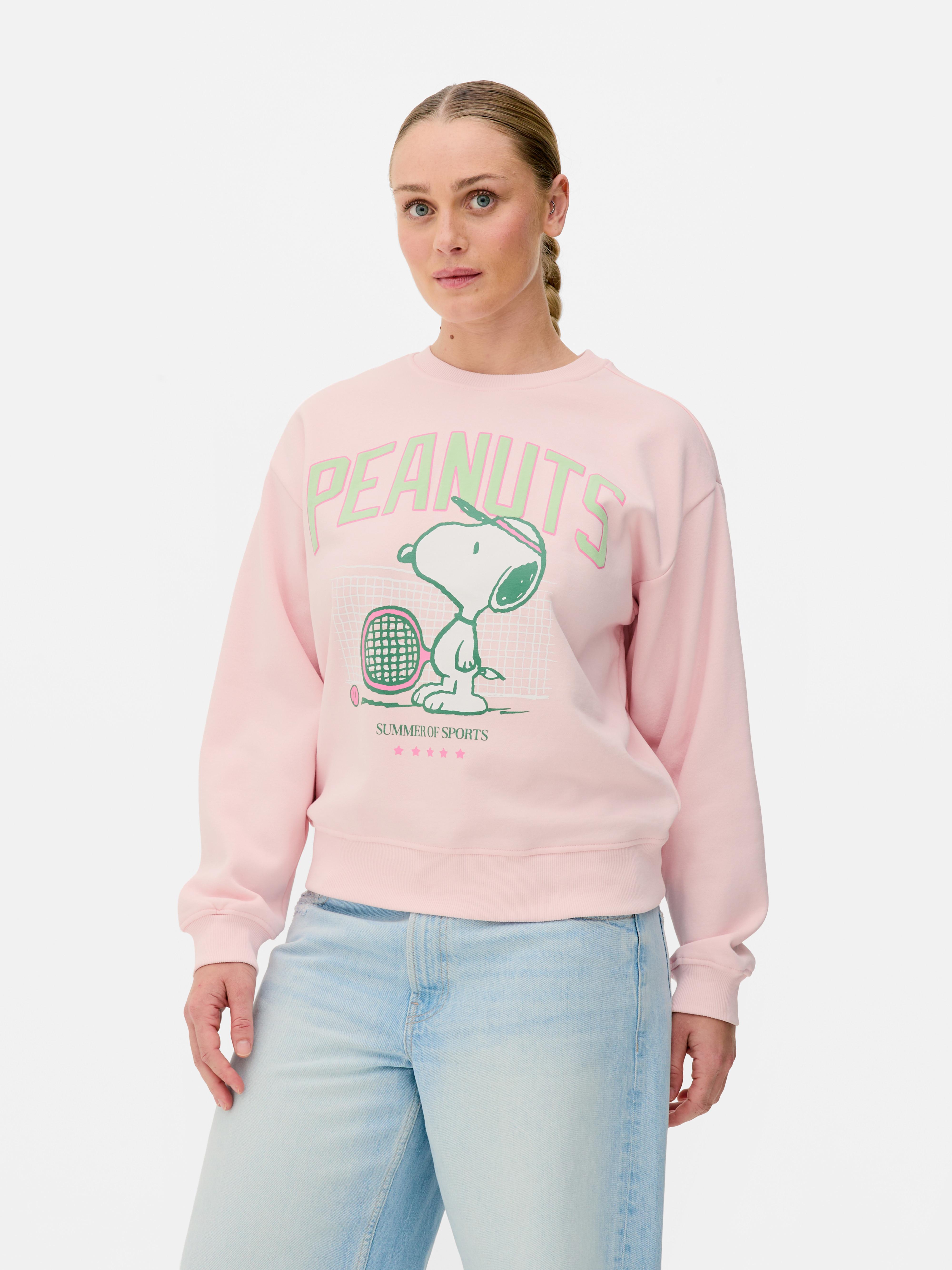Sudadera de Snoopy jugando al tenis